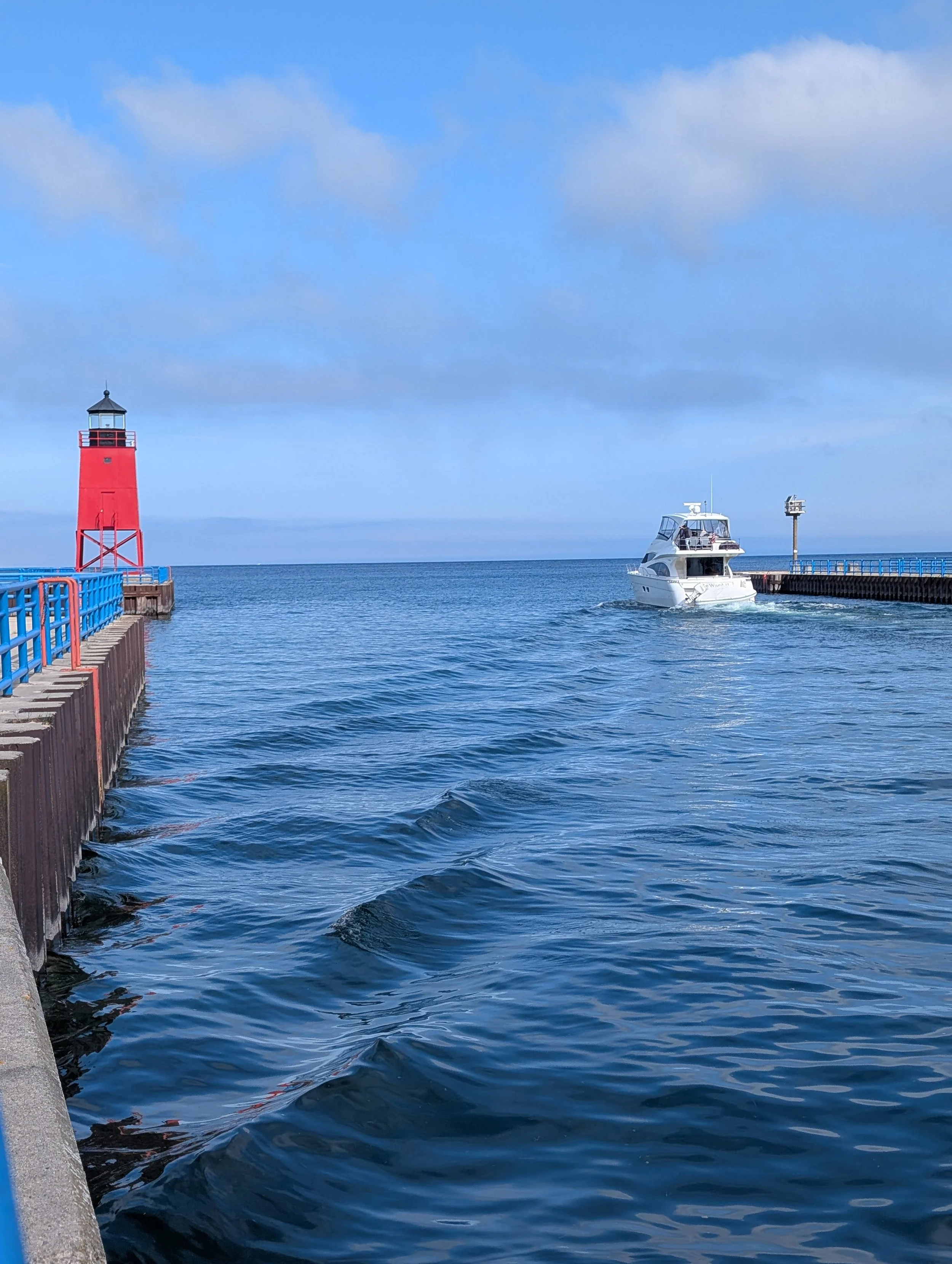 boat entering Lake Michigan from Charlevoix