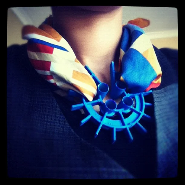 Weaving with a found object.