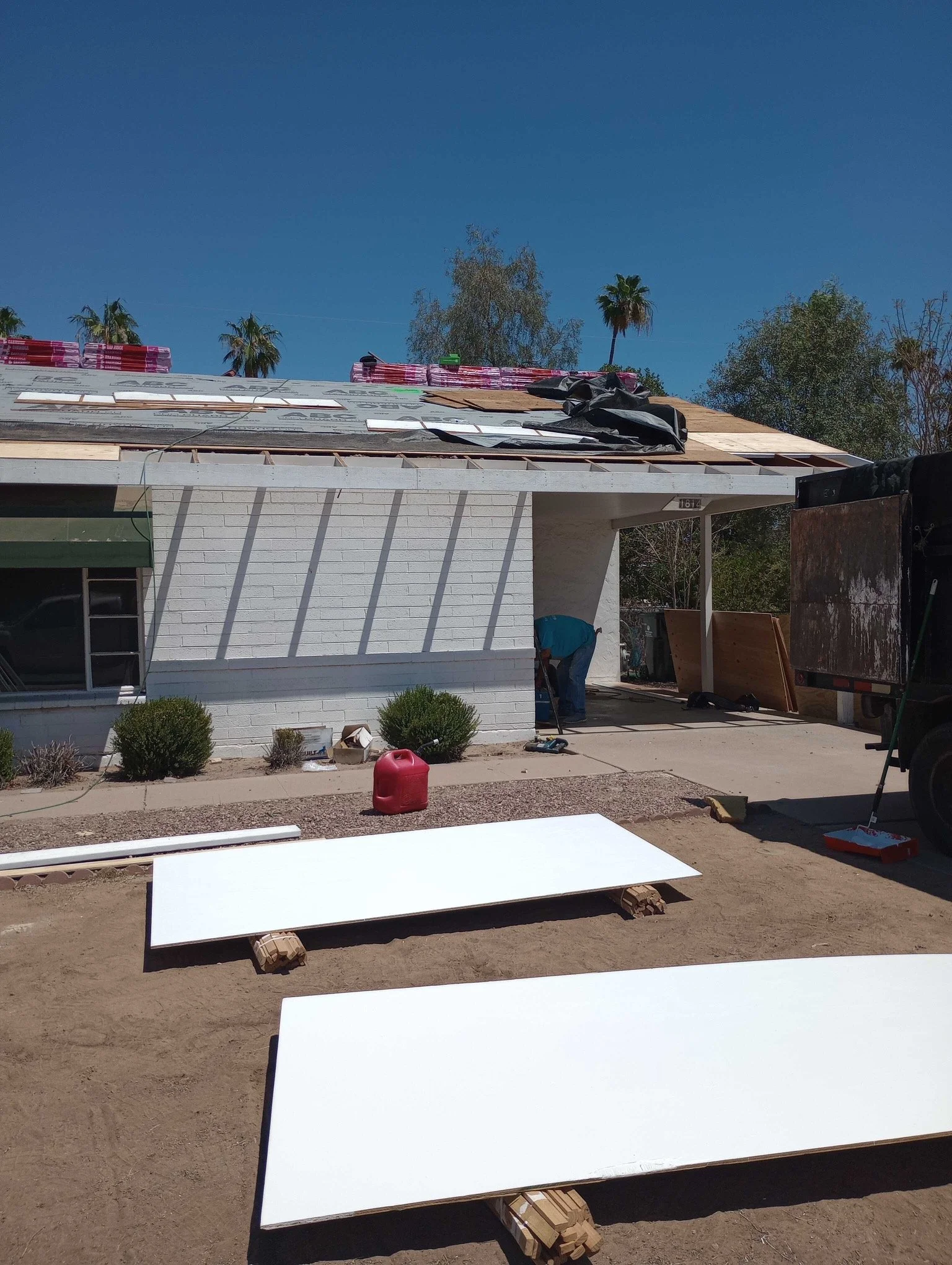 Professional roof repair and leak detection team working on a residential roof in Paradise Valley.