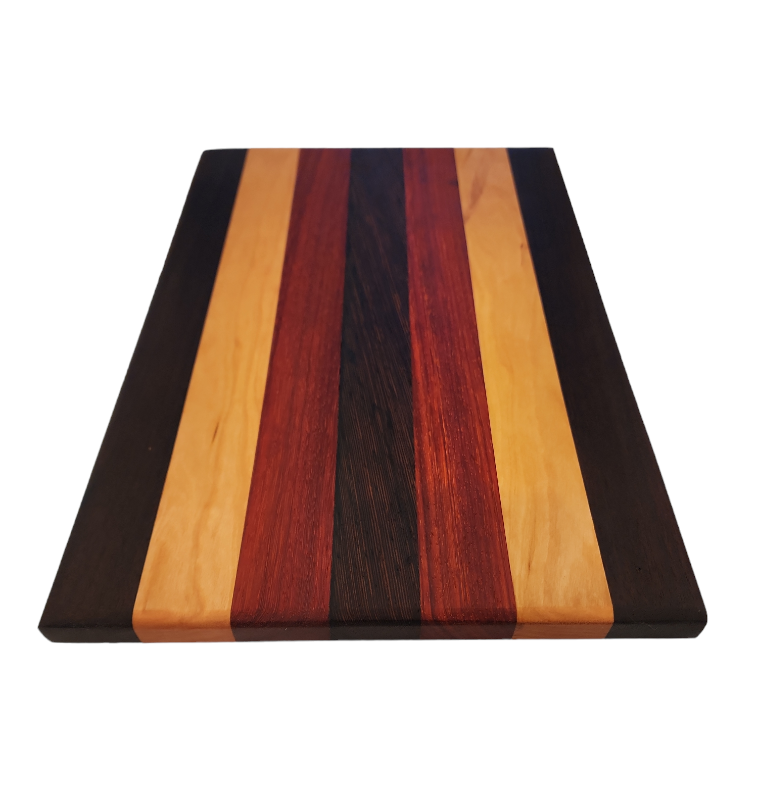 A rectangular wooden cutting board with a striped pattern of light, red, dark, and black wood.