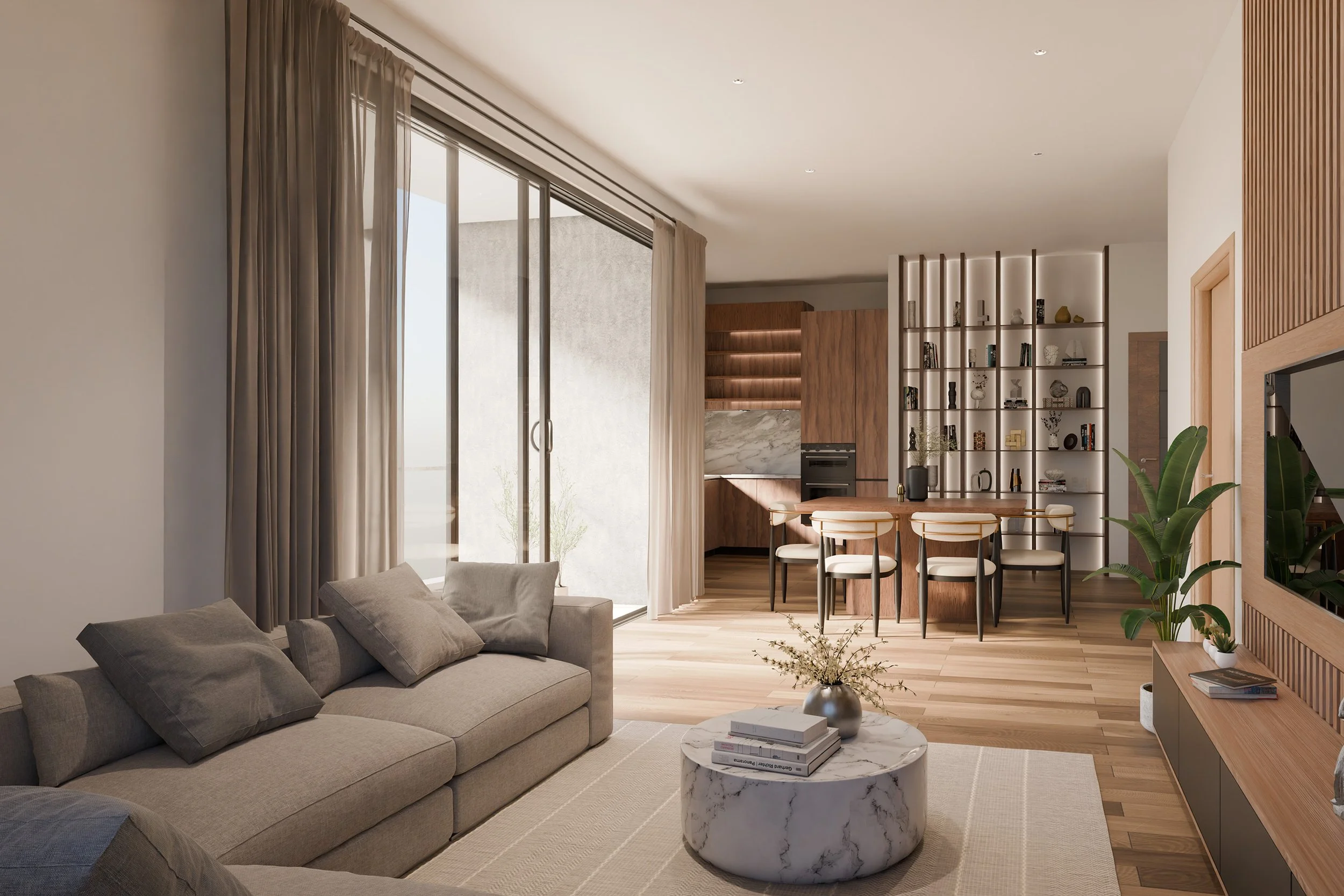 Modern living room with beige sofa, round marble coffee table, and large window with curtains, open to a wooden kitchen and dining area with shelves and plants.