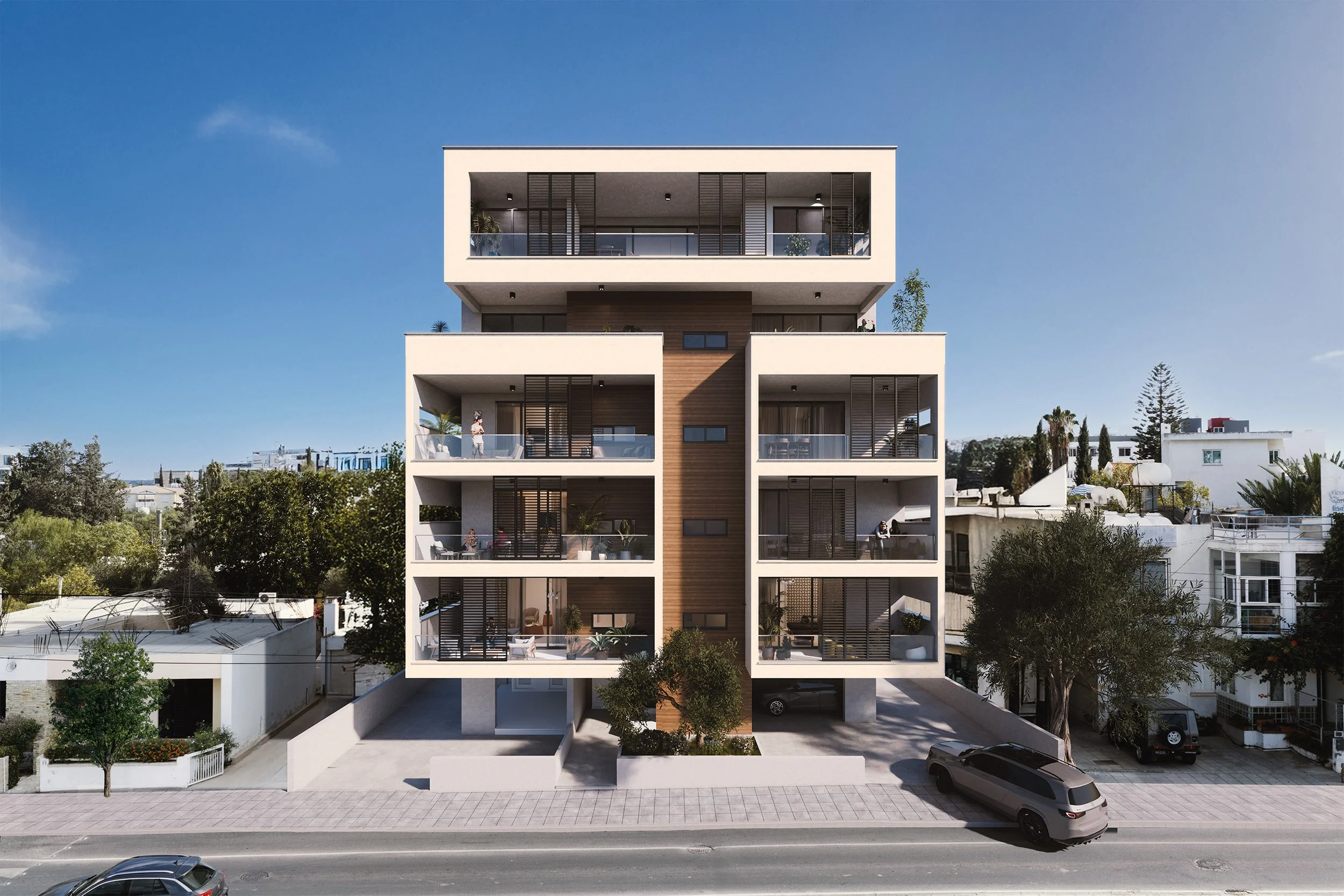 Modern multi-story residential building with balconies, surrounded by trees and parked cars, under a clear blue sky.
