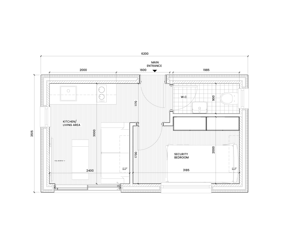 Floor plan of a small house with a main entrance leading into a hallway, a combined kitchen and living area, a security bedroom, and a bathroom with a toilet and sink.