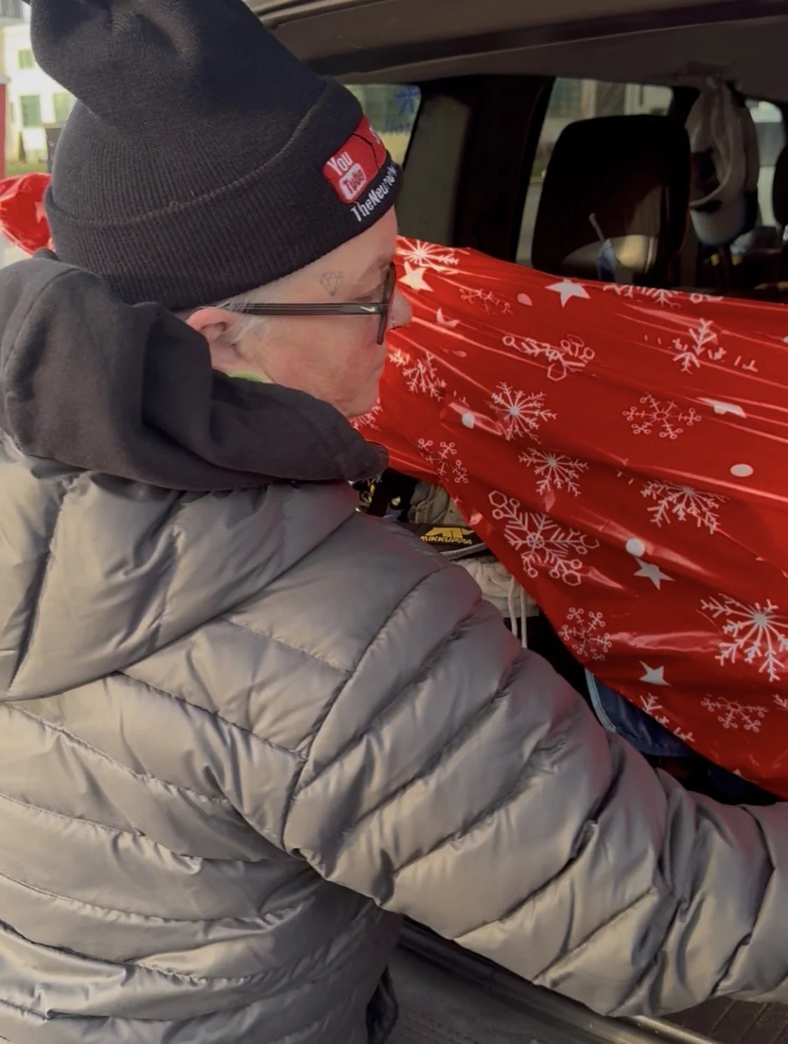 person unloading gifts for a gift drive