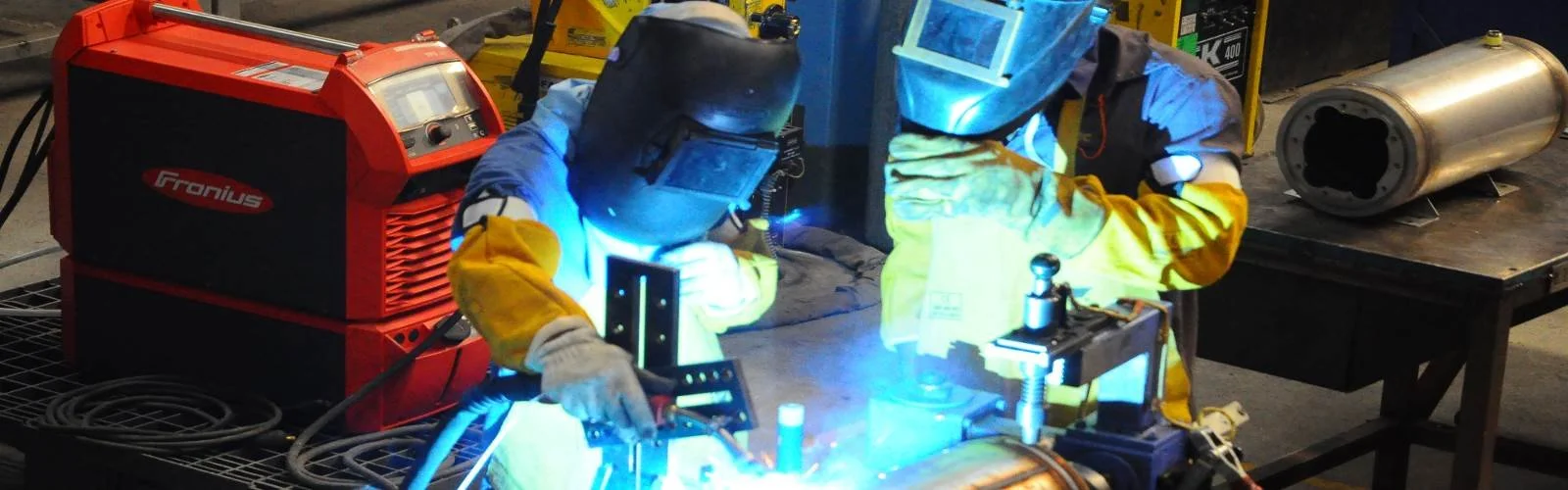 Oranssi technician working on a roof project
