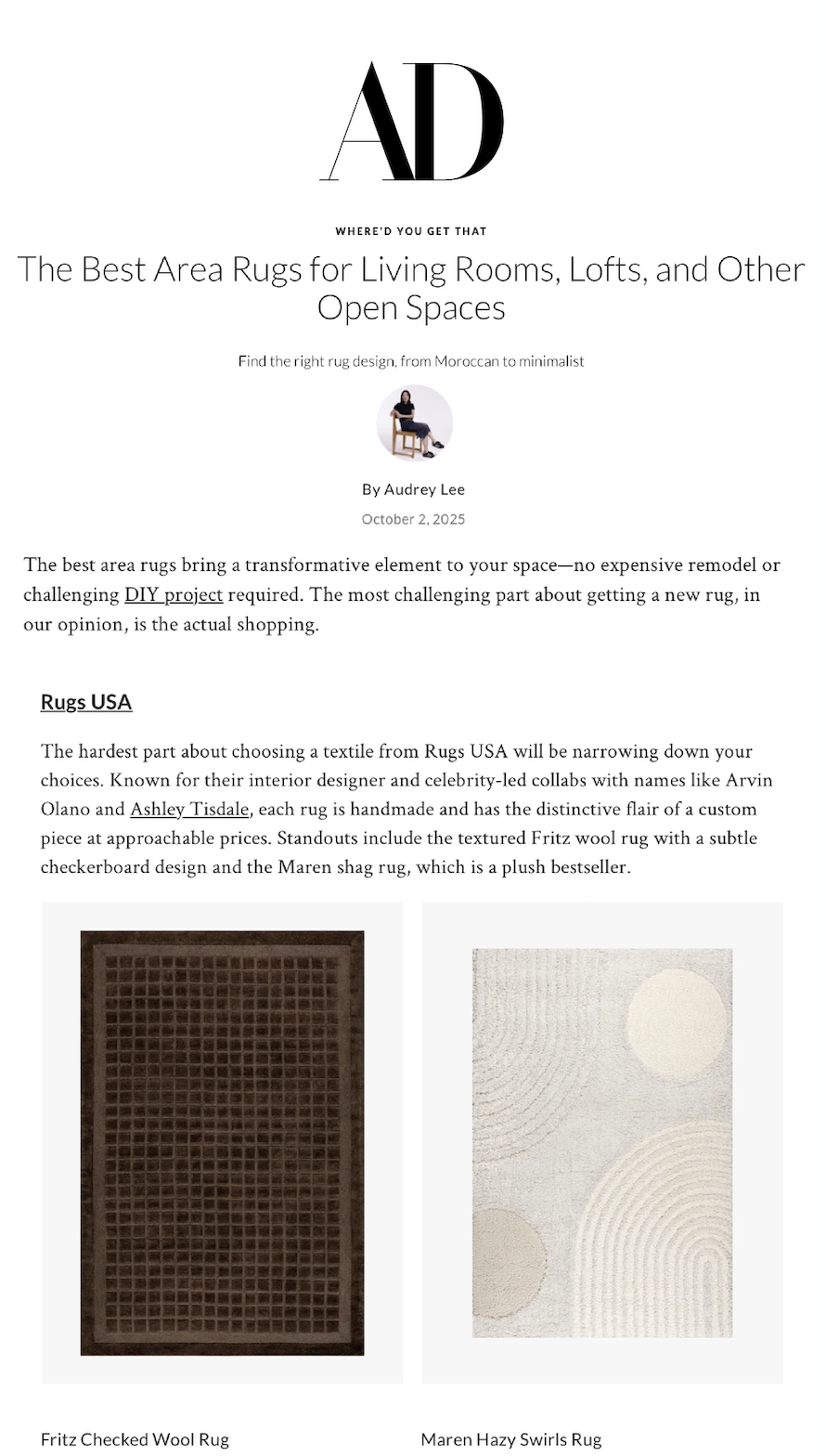 A webpage from AD magazine discussing area rugs for living rooms, lofts, and open spaces, with images of a Fritz checked wool rug and a Maren hazy swirls rug.