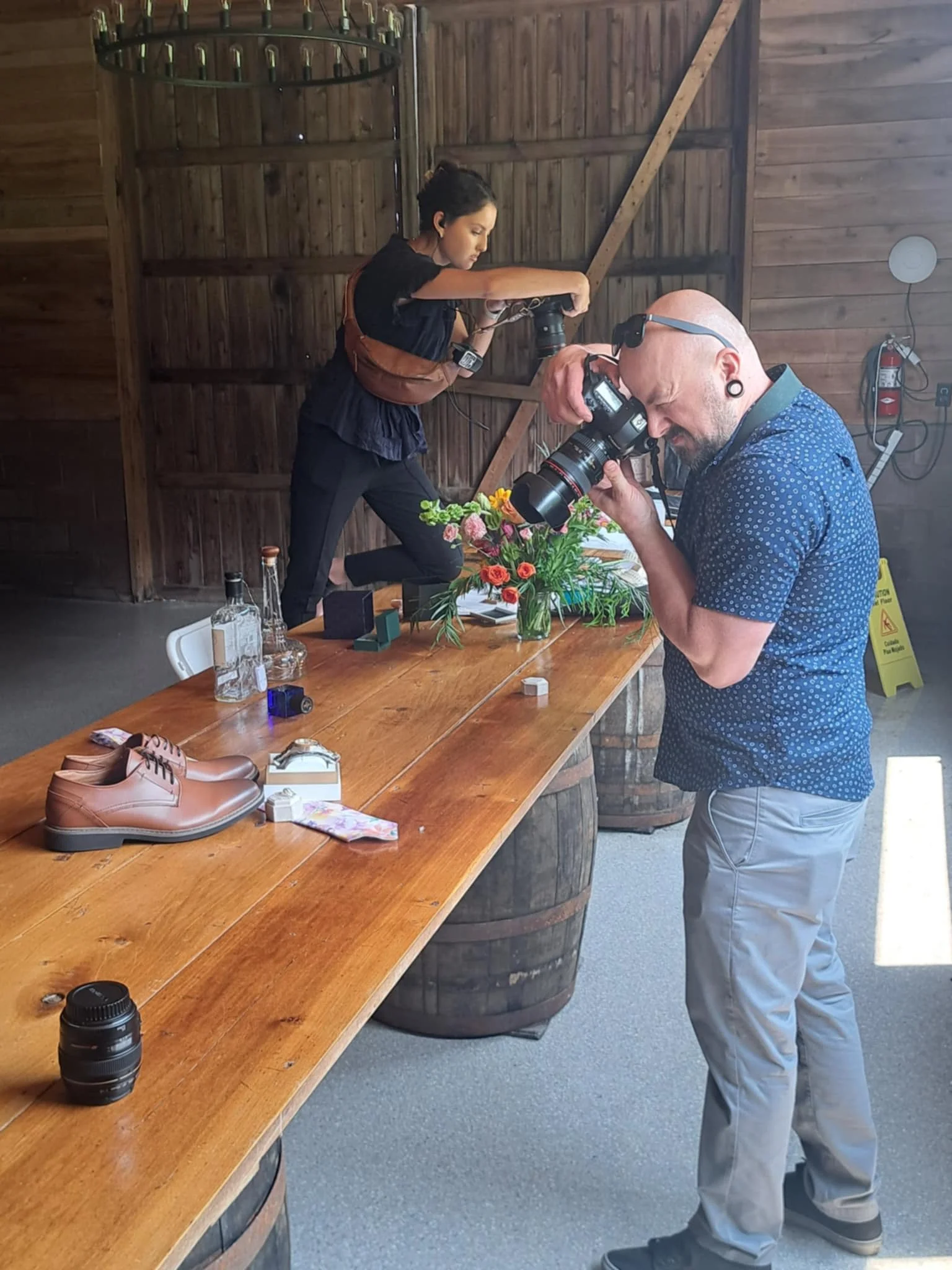 Kenzie, of Kenzie Riley Photography from Kentucky at Red Gate Farm and Vineyard, Quincy, KY capturing bridal details in the barn where the reception is held.