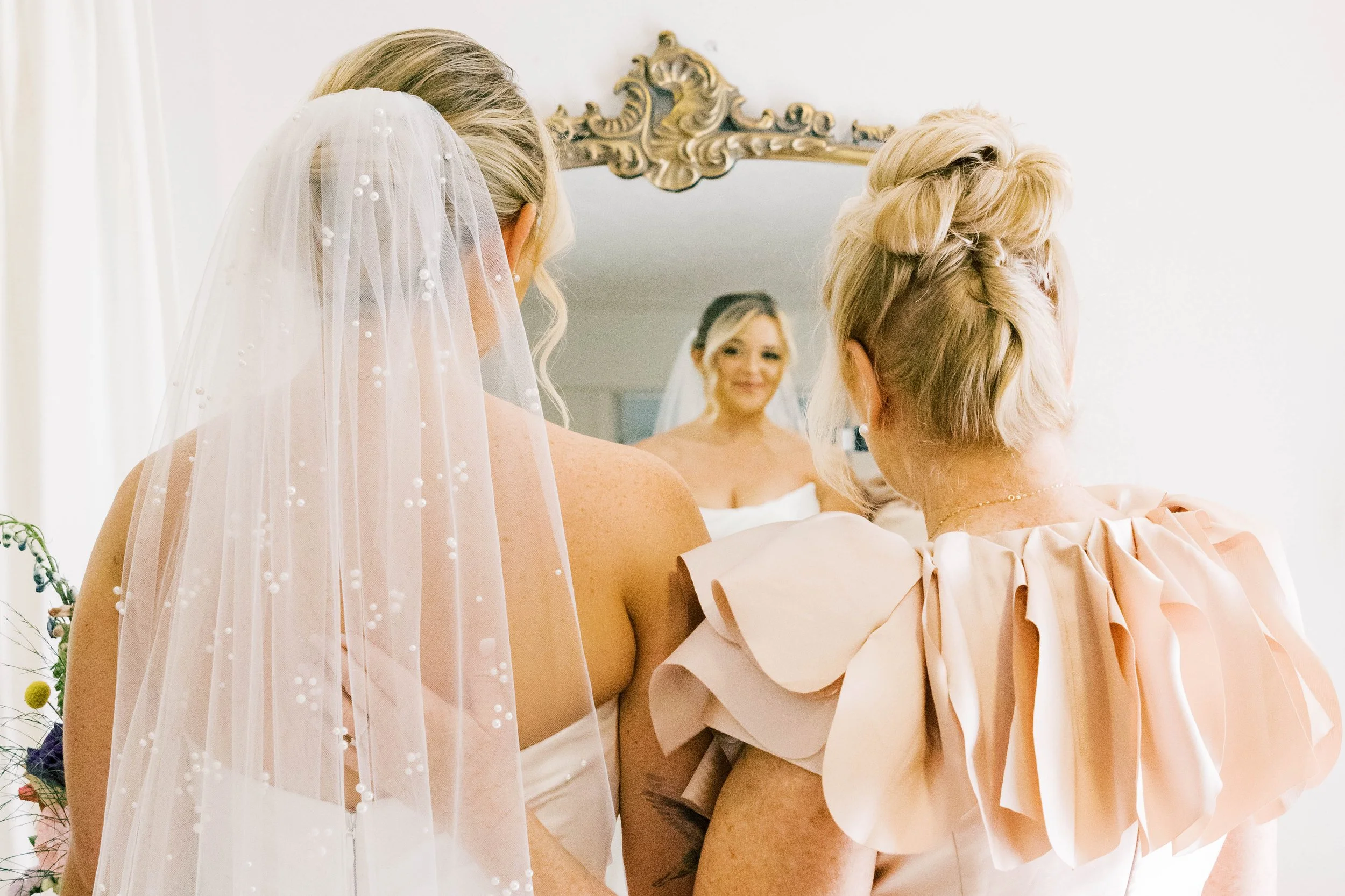 A bride and her mother during their first look at Red Gate Farm and Vineyard by Kenzie Riley Photography - Kentucky Wedding Photographer.