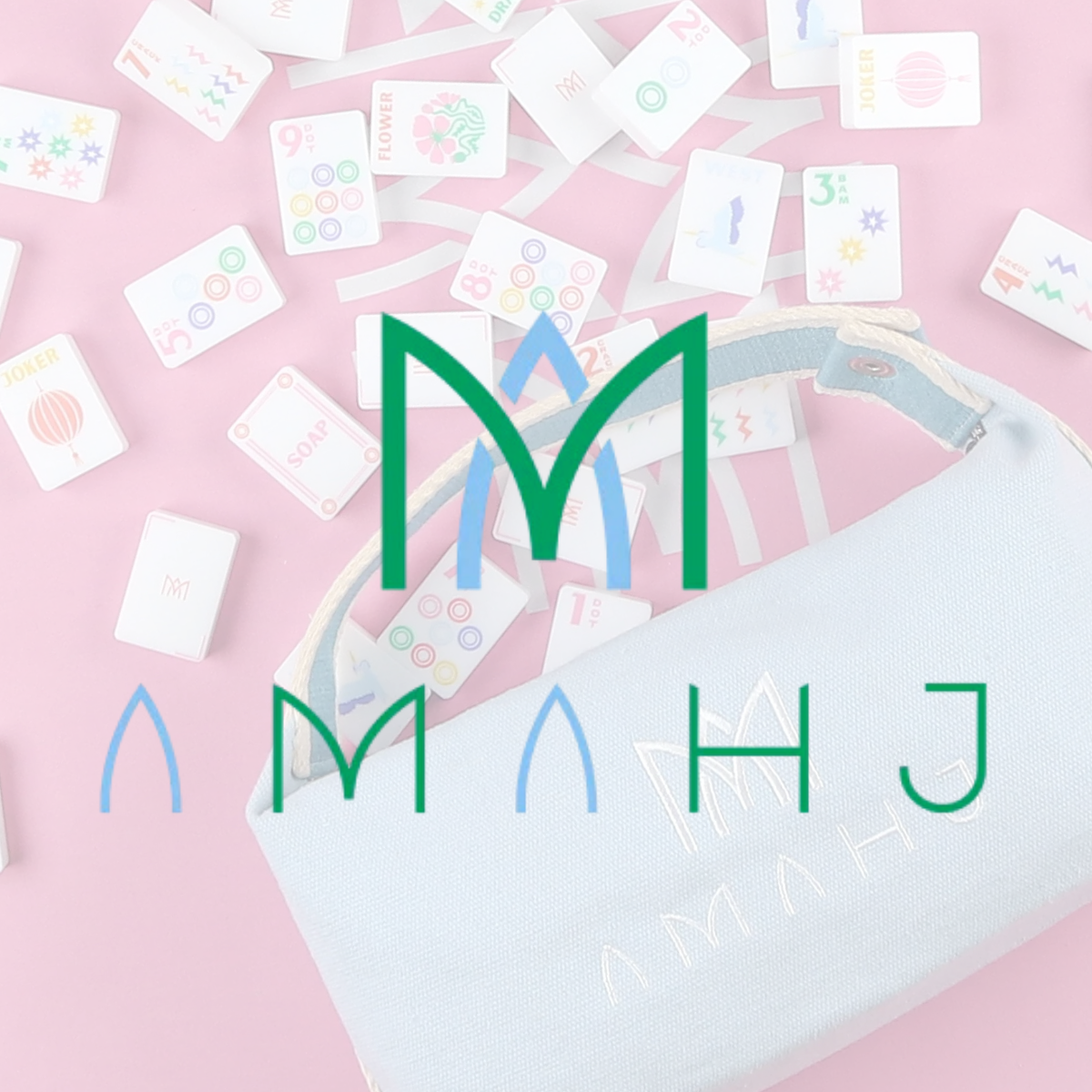 Table with scattered dominoes that have colorful designs and words like 'flower,' 'soap,' and 'jokers' on them, with a bag in the foreground.