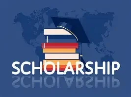 Stack of books with a graduation cap on top, the word 'SCHOLARSHIP' beneath, and a world map background.