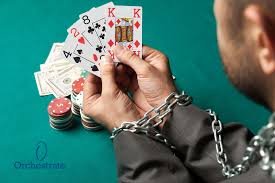 Person holding a royal flush of playing cards with poker chips on a green table