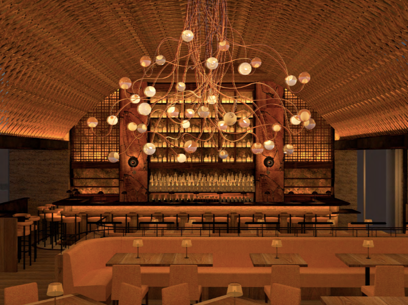 Interior of a stylish bar or restaurant with a curved, wooden ceiling, a large decorative chandelier with multiple bulbs hanging from the center, and a long bar counter with seating. There are shelves behind the bar with bottles and glasses.