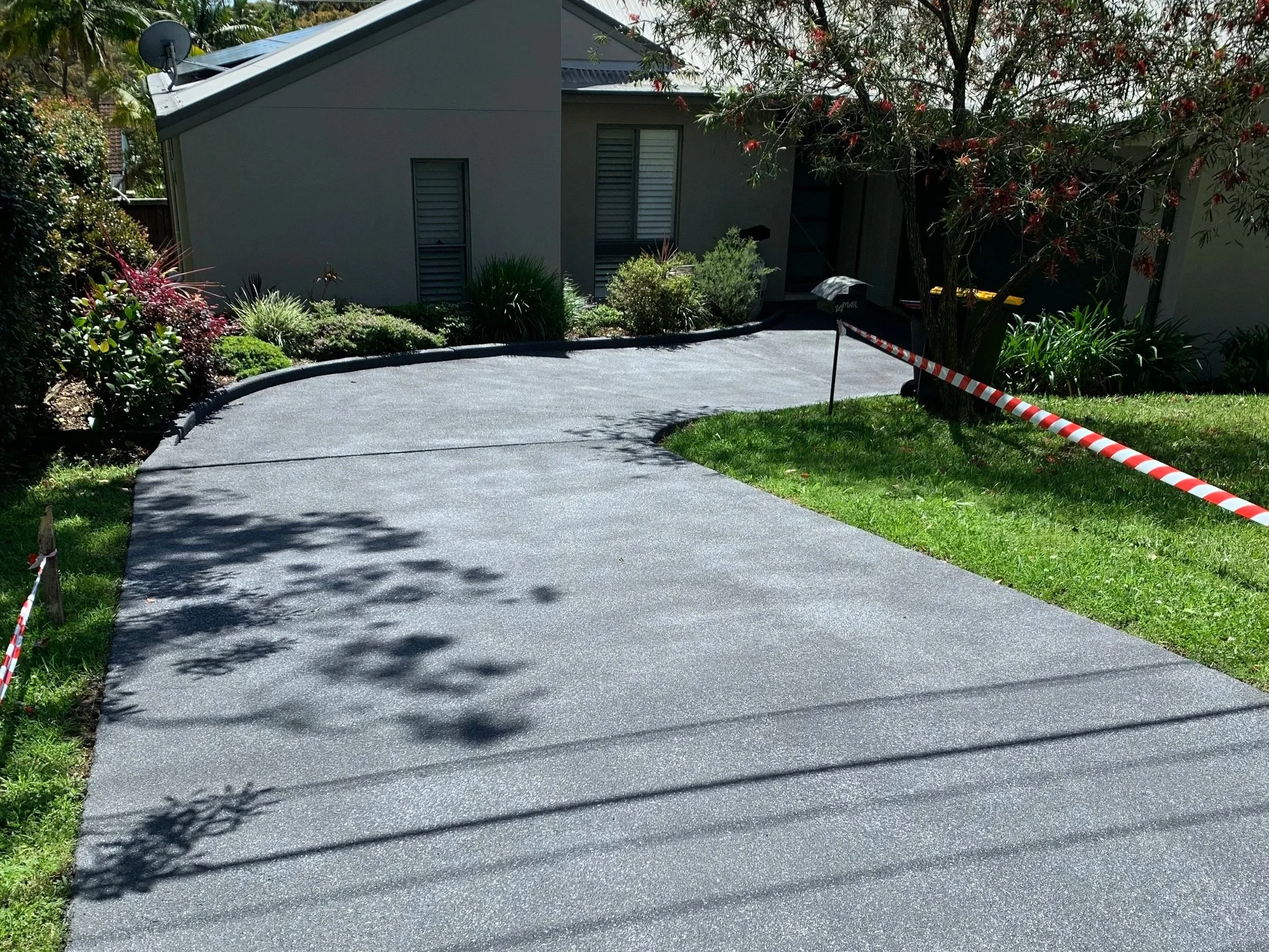 The Result: We achieved a uniform, "new pour" look by prepping the substrate and applying a consistent light gray resurfacing compound. The result is a seamless, durable surface that looks like a brand-new slab at a fraction of the replacement cost.