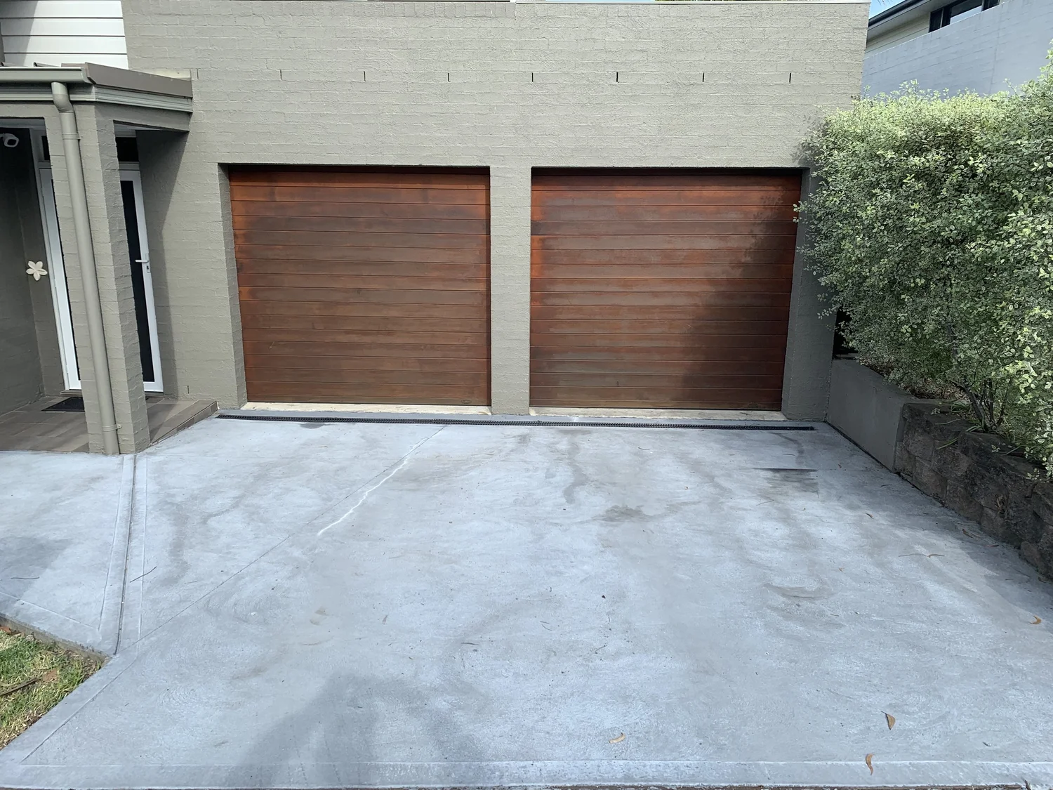 Worn concrete driveway entrance in Warriewood before resurfacing