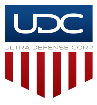 The logo of Ultra Defense Corps (UDC), featuring blue, white, and red colors with a shield design.