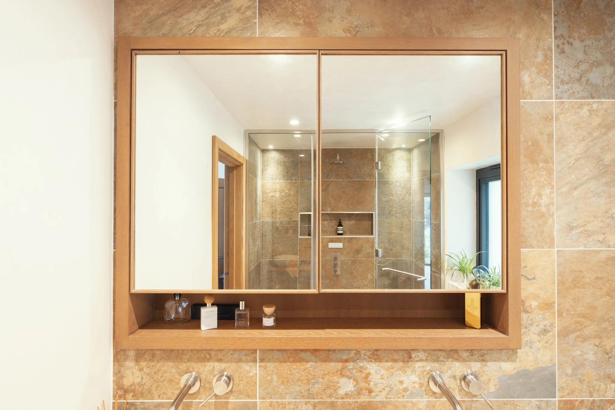 Bespoke oak bathroom cabinetry with integrated storage, Devon