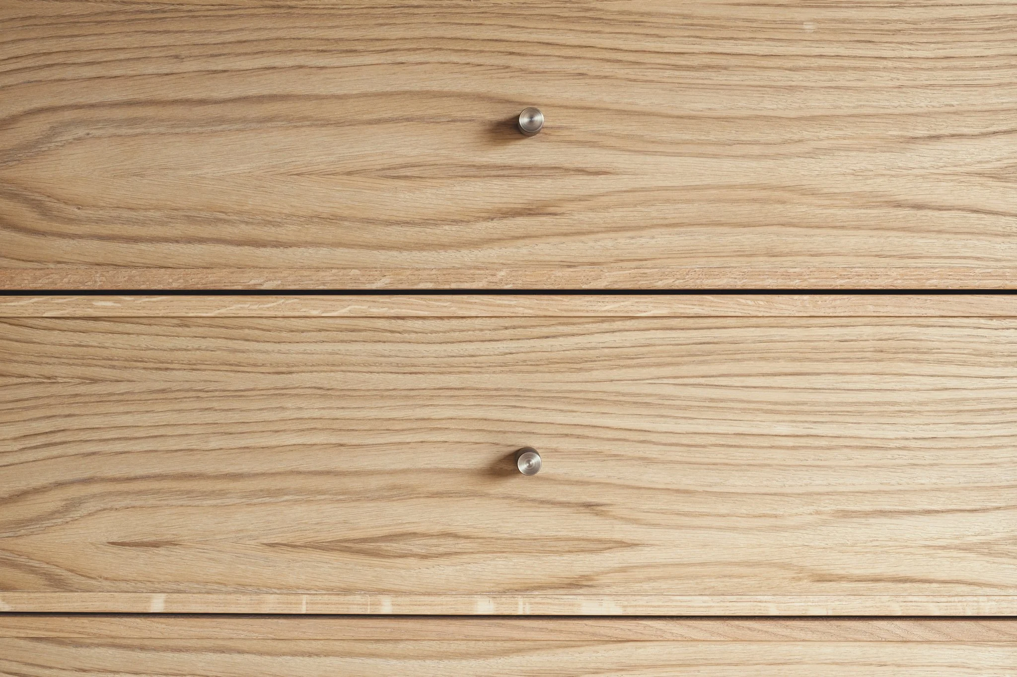 Luxury bespoke master dressing room wardrobes with pivot pocket doors and oak veneer in Dartmouth, Devon