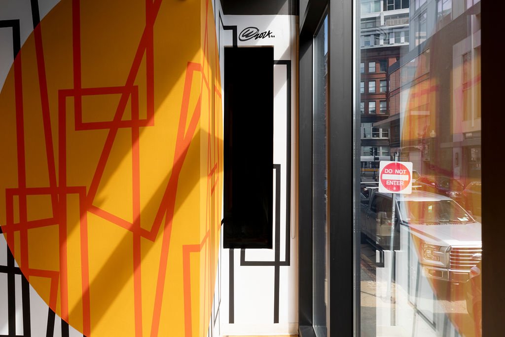  Cyrille Conan,  DIWAR-BENN (à propos) , 2024. Site-specific mural for Utile, 115 Kingston Street, Boston, MA. Project facilitated by art_works for Utile. © Cyrille Conan. Photography by Mel Taing. 