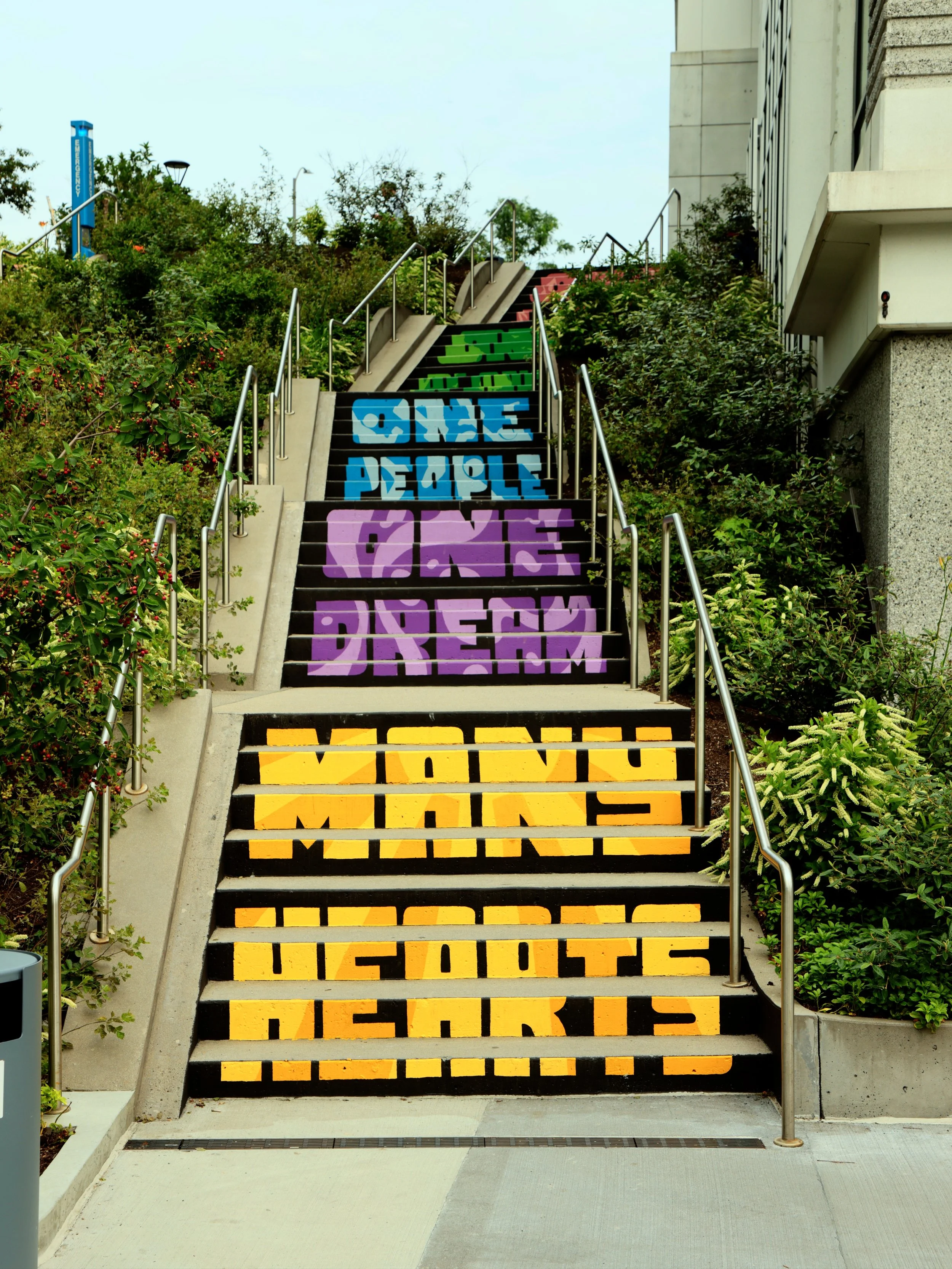  Michael Talbot &amp; Phoebe Warner,  Collective Ascension , 2023. Site-specific mural. Brian P. Murphy Memorial Staircase, Cambridge, MA. Project executed in collaboration with Community Art Center and facilitated by art_works for DivcoWest. © Micha