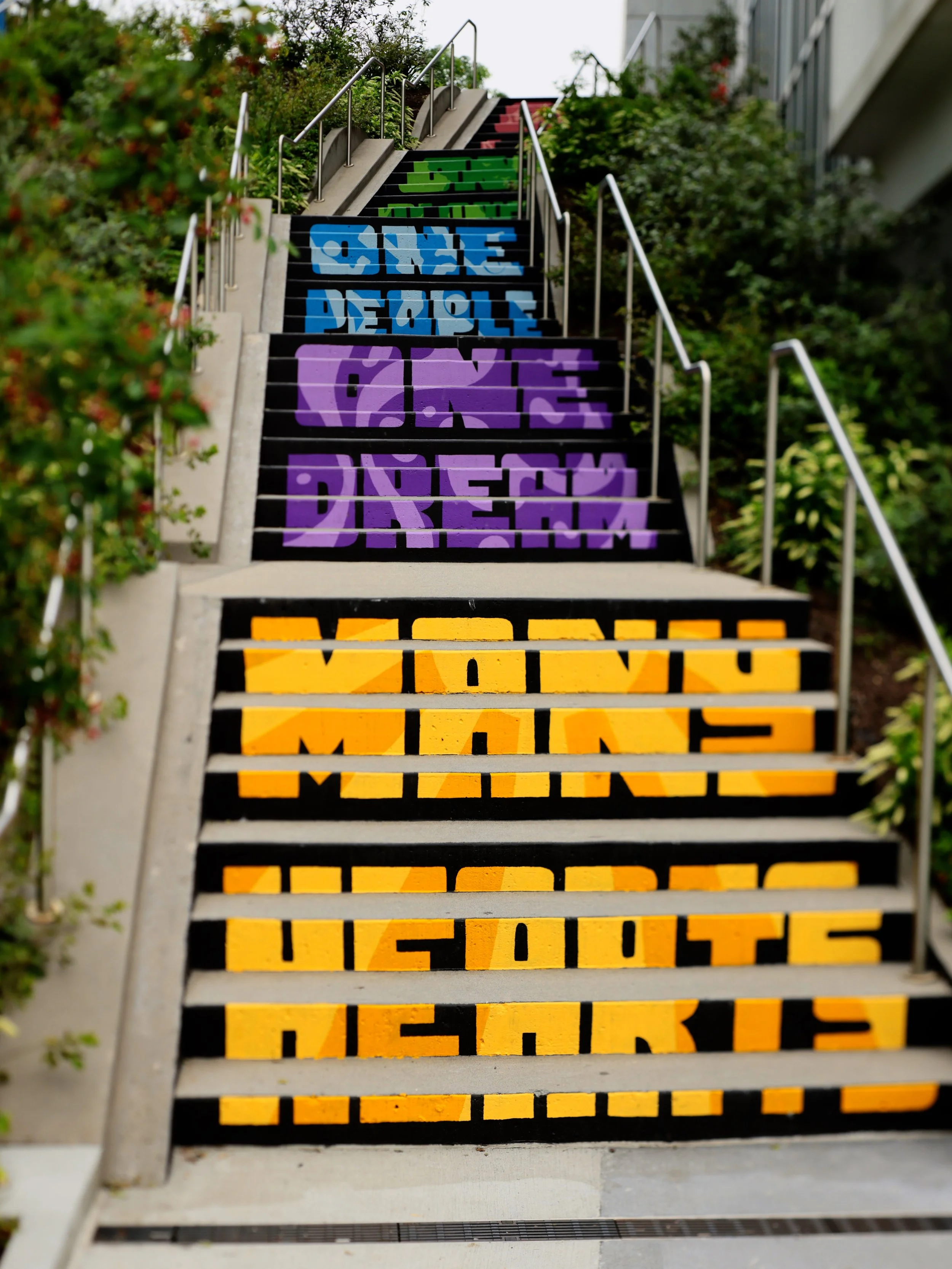  Michael Talbot &amp; Phoebe Warner,  Collective Ascension , 2023. Site-specific mural. Brian P. Murphy Memorial Staircase, Cambridge, MA. Project executed in collaboration with Community Art Center and facilitated by art_works for DivcoWest. © Micha