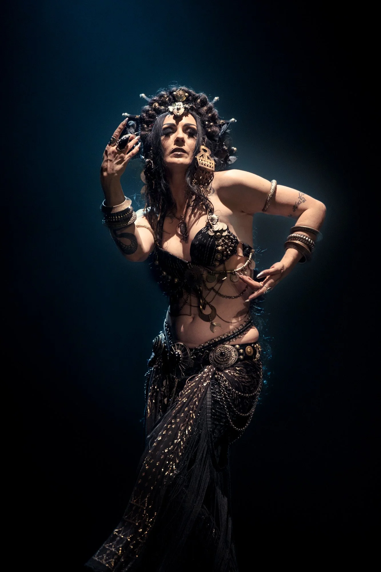 Tribal fusion dancer Tiare Valouria photographed on stage at a Tribal and Flames event in Barcelona.