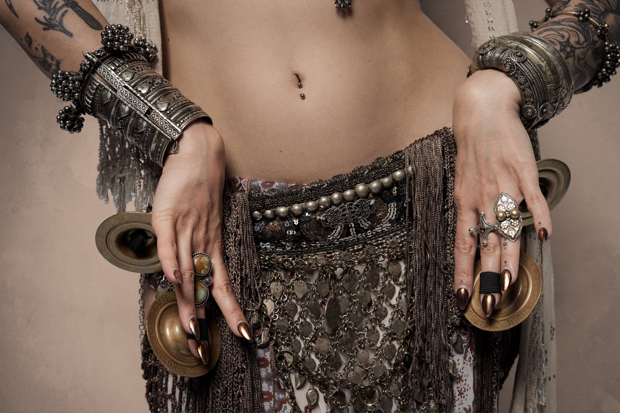 detail of tribal fusion costume and finger cymbals during studio portrait session