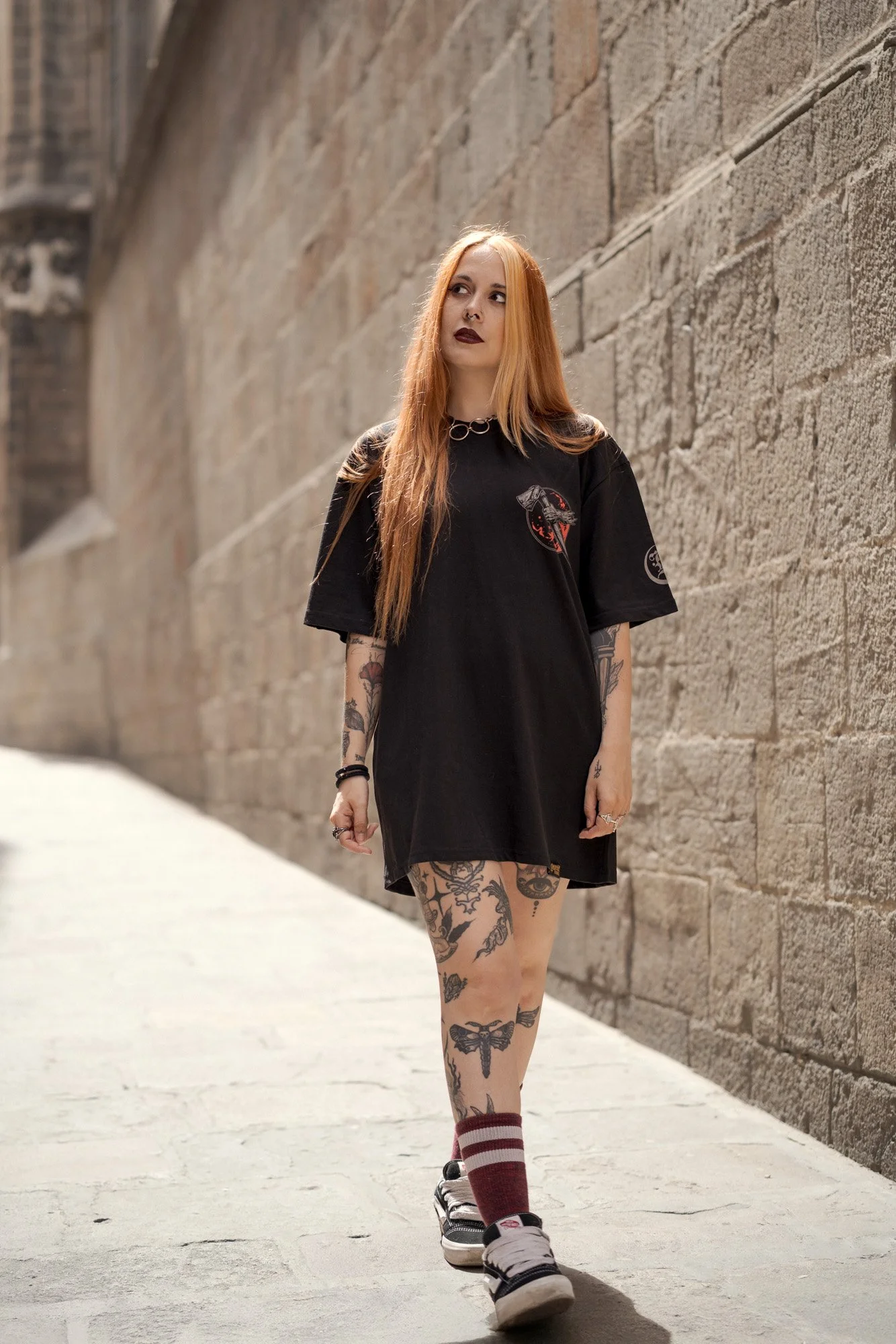 Urban fashion photography of Shara Wolf walking through the Gothic Quarter of Barcelona.