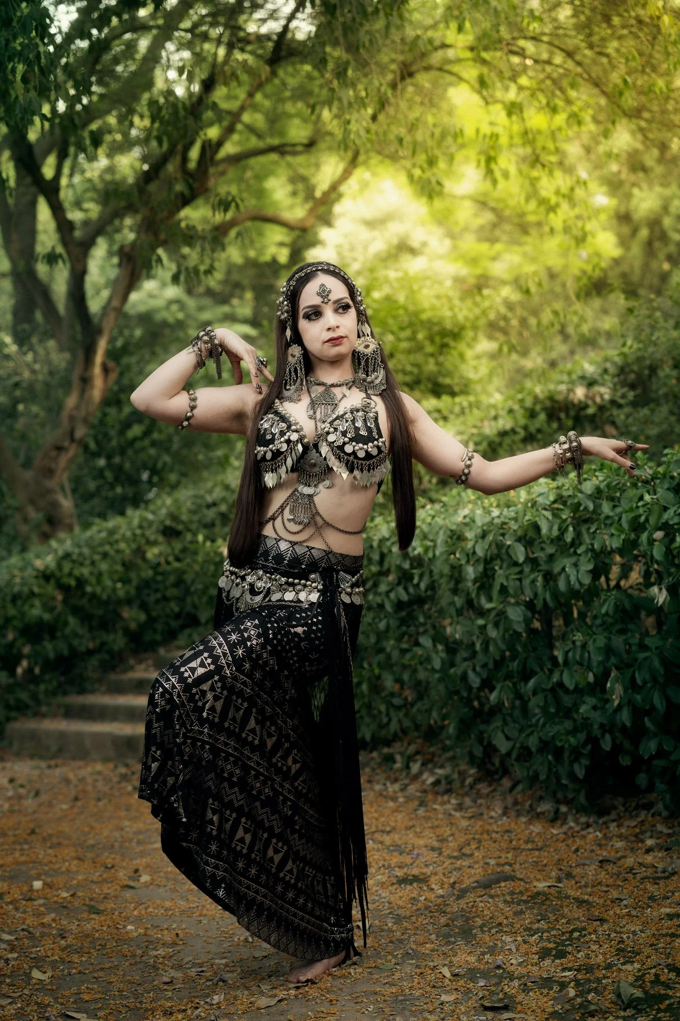 Michelle Bettridge performing a tribal fusion pose among the gardens of Montjuïc in Barcelona