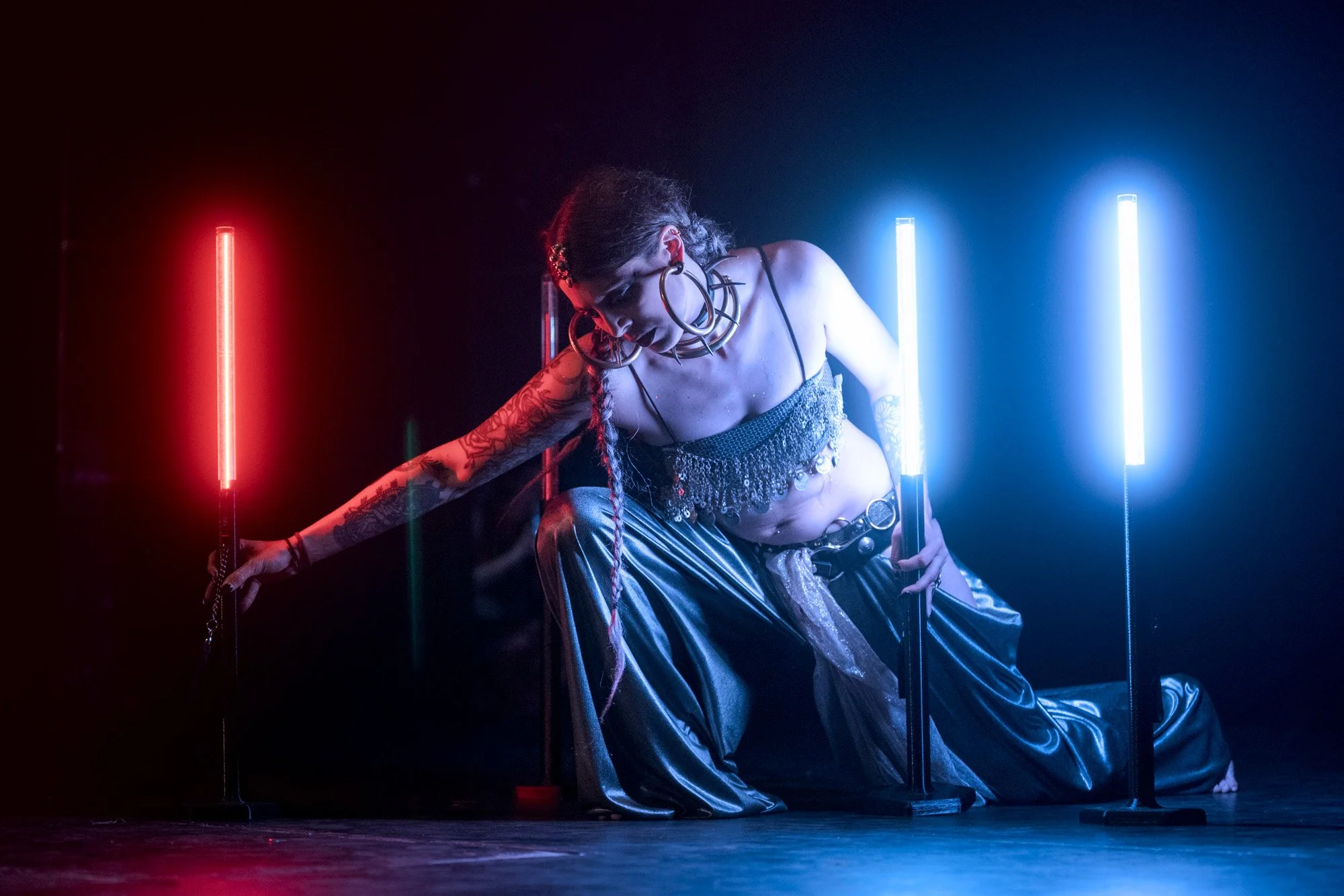 Stage performance by Anna de Mas, known as cosmosdaughter, photographed during a tribal fusion dance festival.
