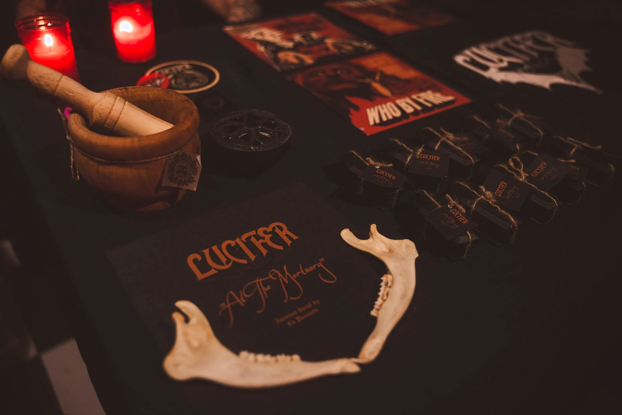 detail of band merchandise displayed on table at concert venue