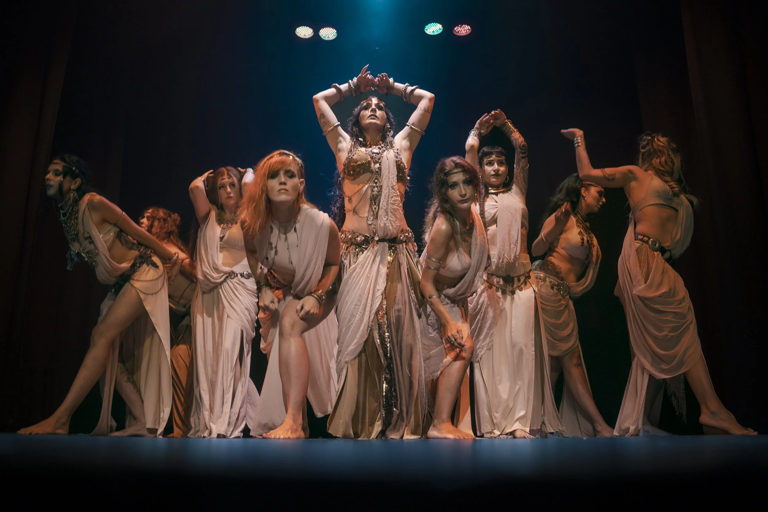 Tiare Valouria performing group project with students during tribal fusion recital.