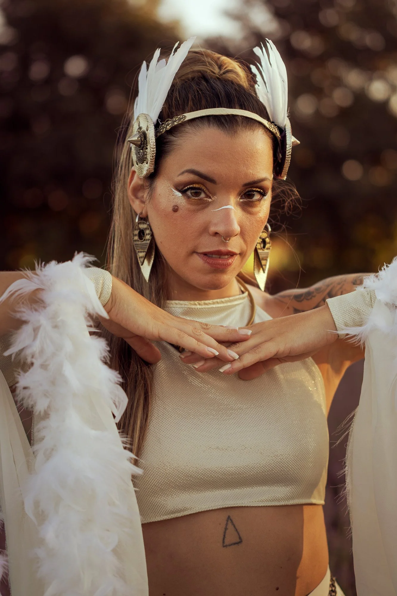 Portrait of Carla Imix in tribal fusion styling, soft golden hour light and ethereal color grading.