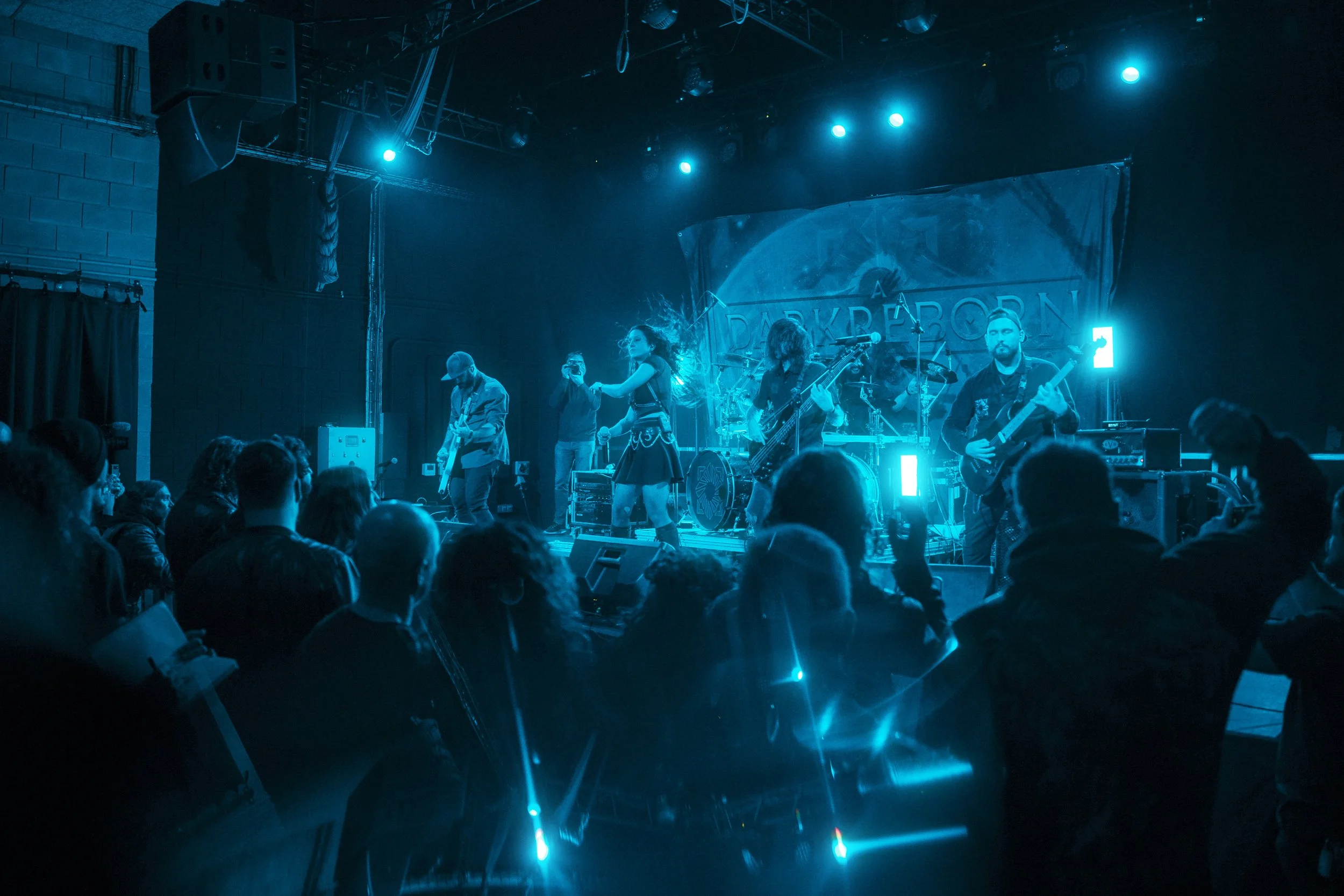 A Dark Reborn performing live at Menhir Fest, captured during a heavy metal concert.