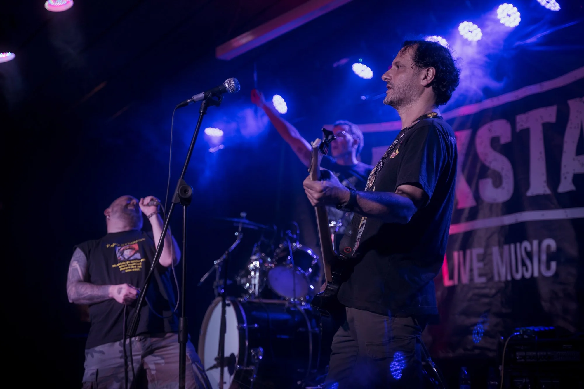 guitarist performing live on stage during metal concert in Terrassa