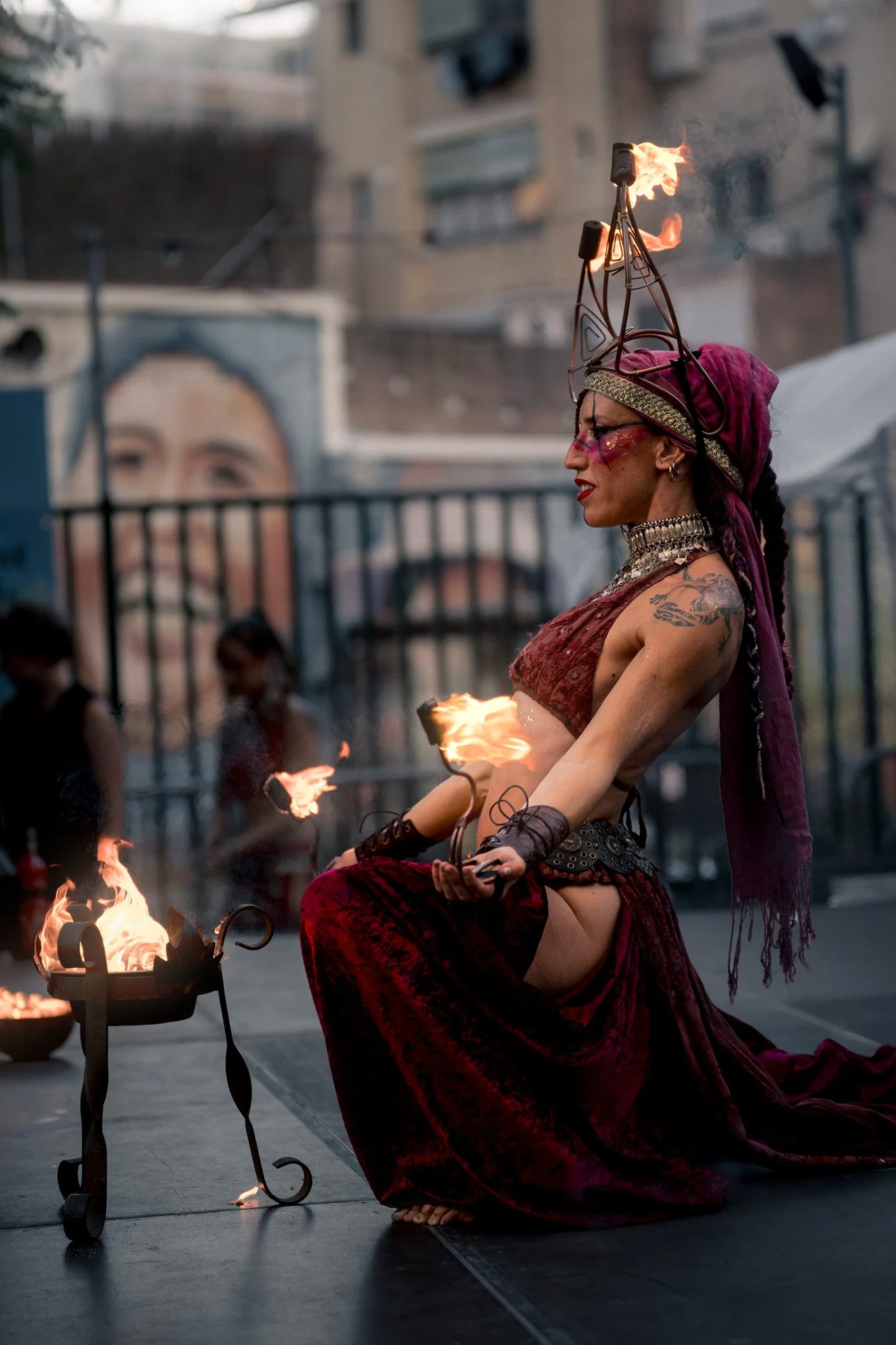 Fire performer Alba Ignea performing with torches during a Sant Jordi street show in Barcelona.