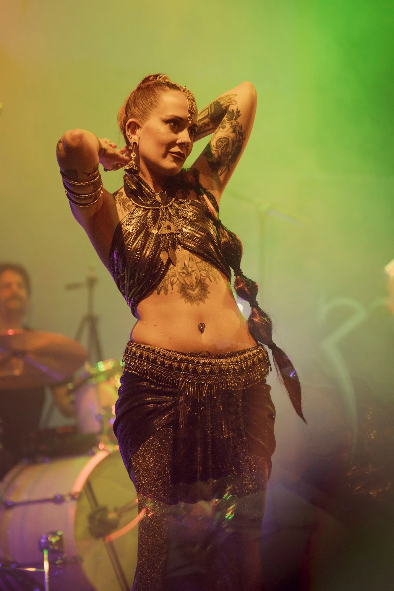 Shara Wolf performing dance on stage during Serapis Project concert.