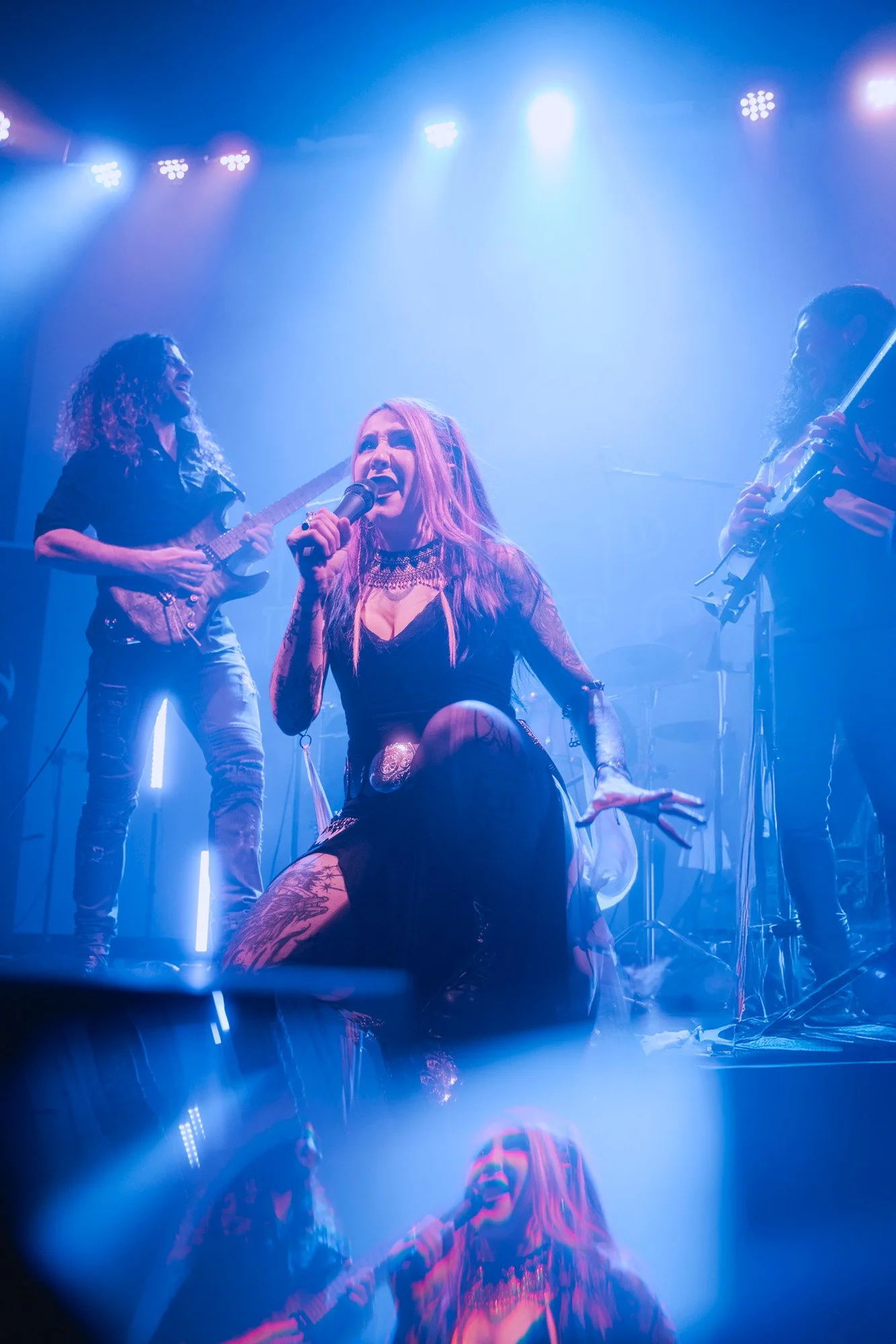 Live concert photography of Serapis Project featuring vocalist Kristina Vega performing on stage.