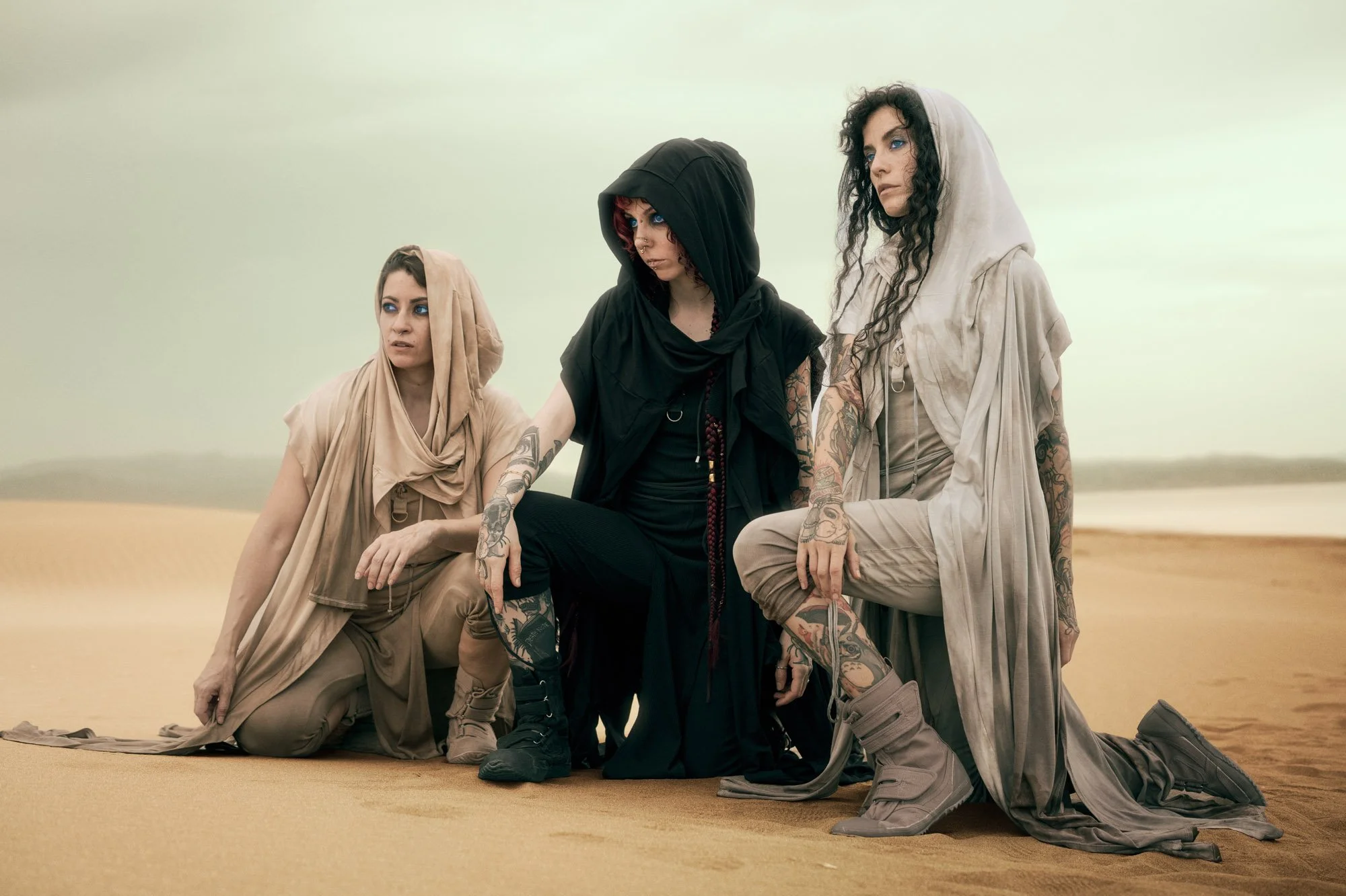 Reverend Mother and two Fremen gathered together in the desert after the ritual