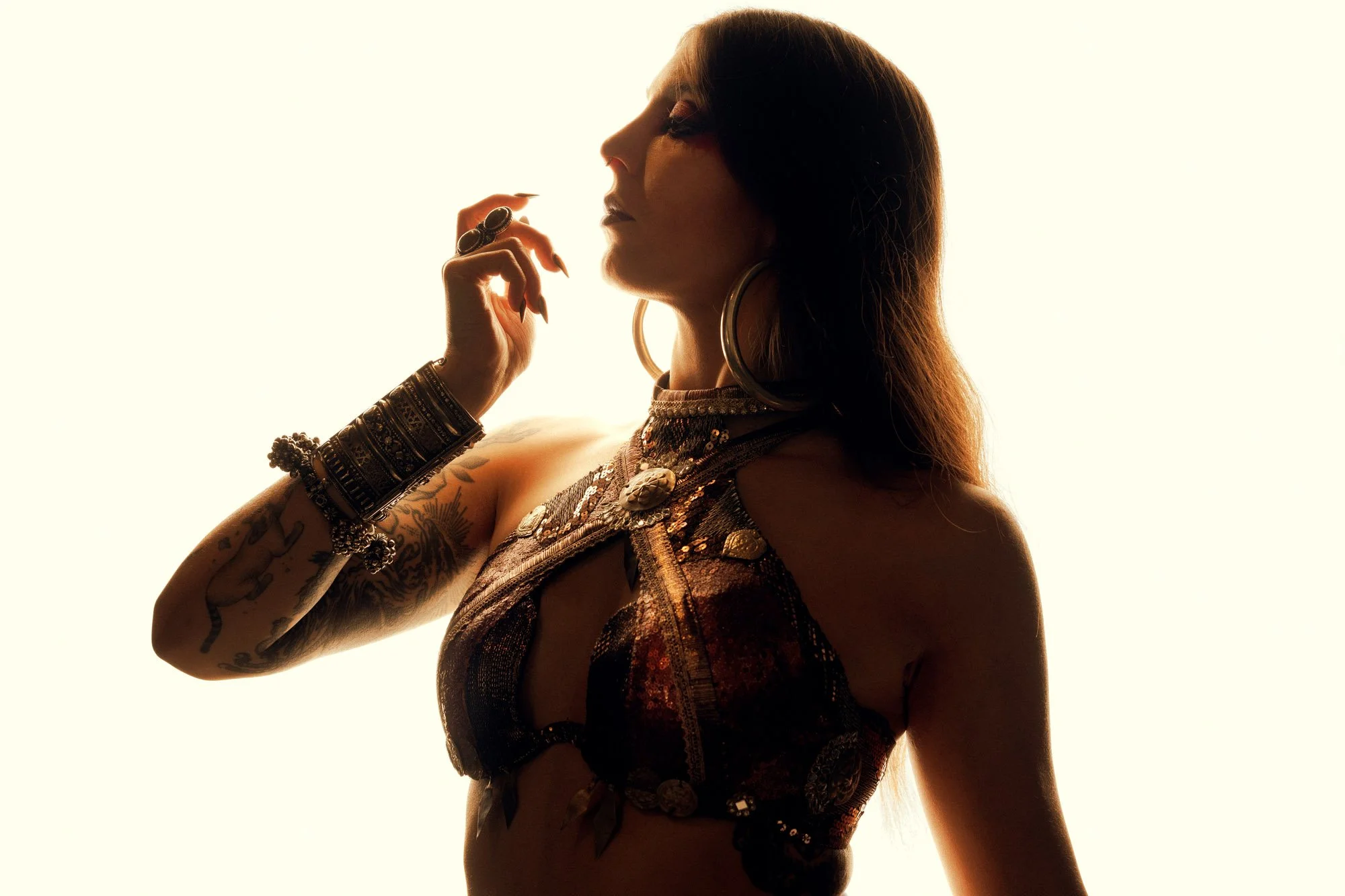 silhouette portrait of Cosmosdaughter against warm backlight in studio
