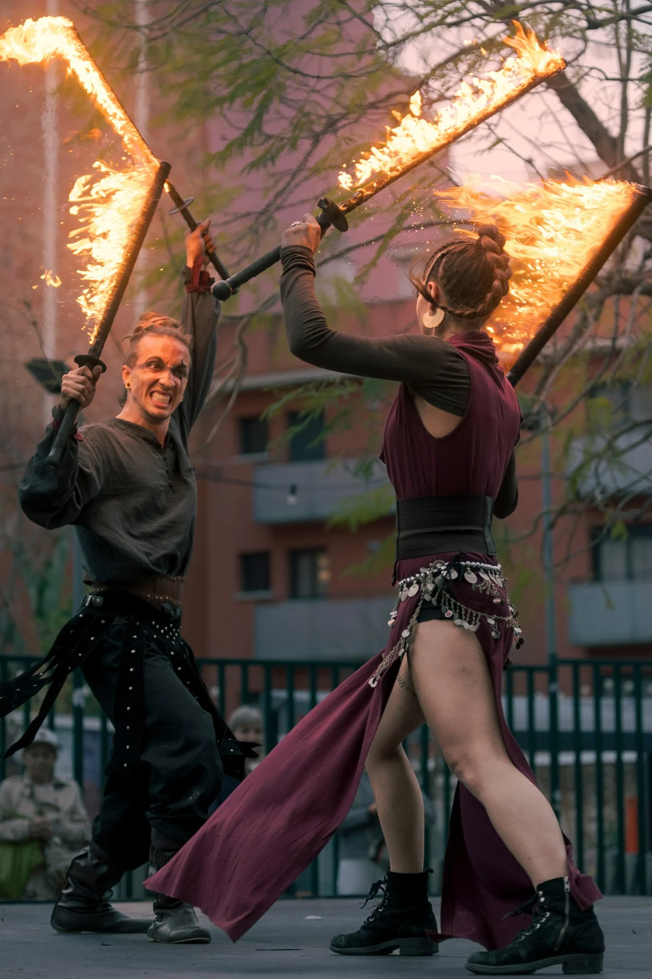 Dynamic fire combat scene performed by Pendrafoc during a public event in Barcelona.