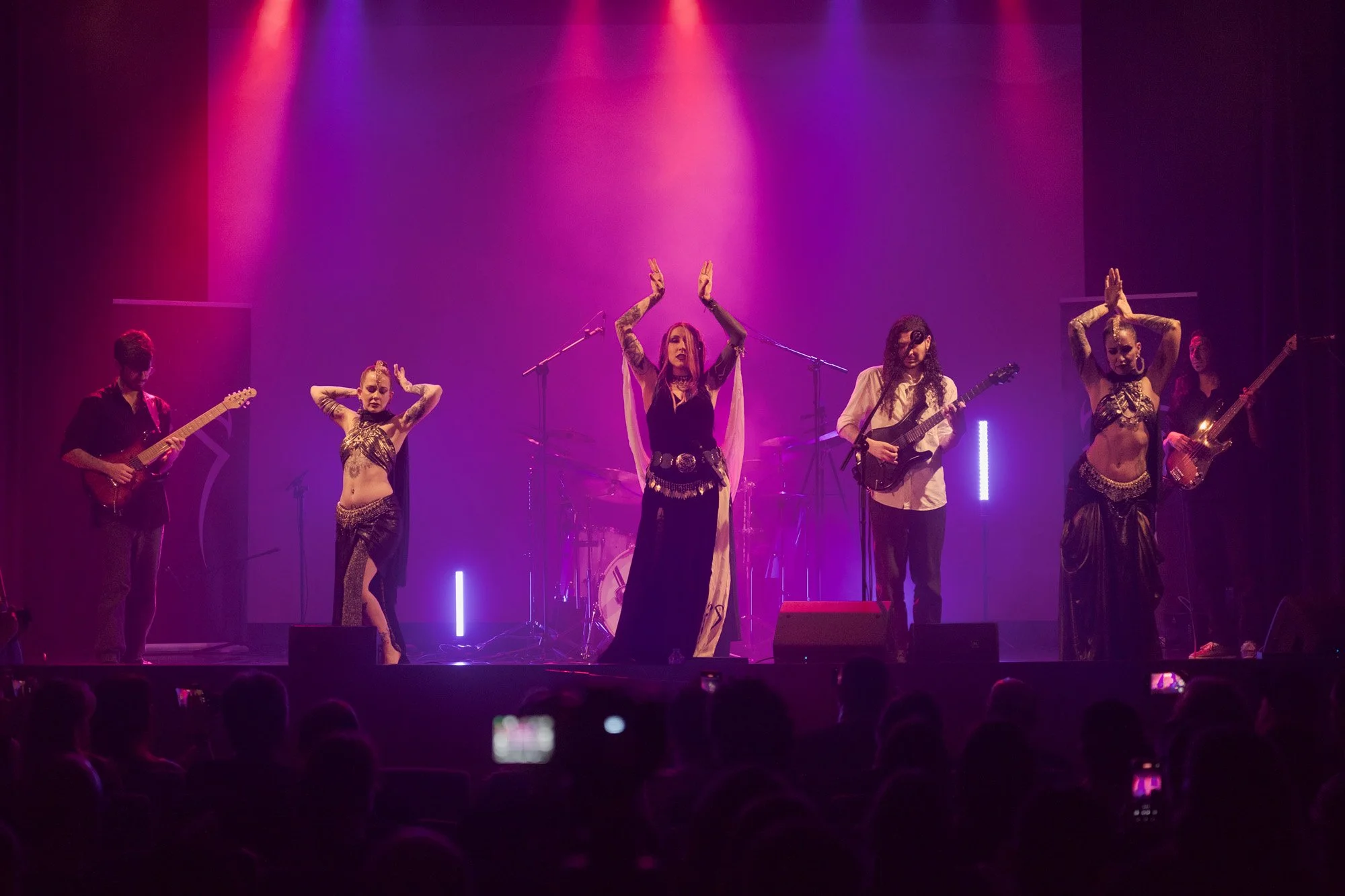 Kris Vega dancing on stage with Shara Wolf and Nur Bloodrose during Serapis Project concert.