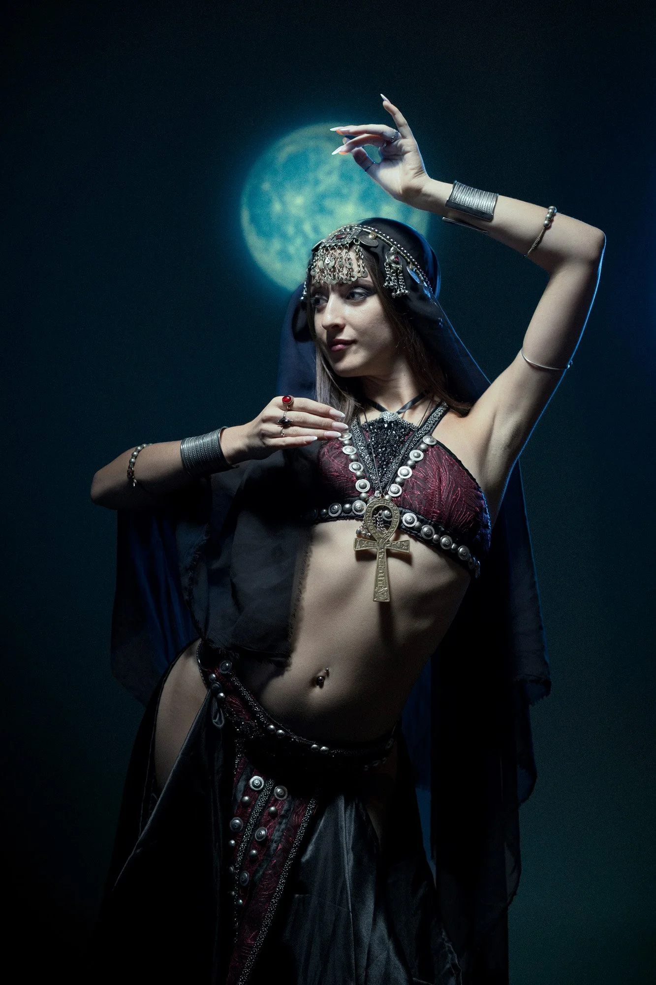 Bellydance and tribal fusion portrait with cool lighting inspired by the moon.