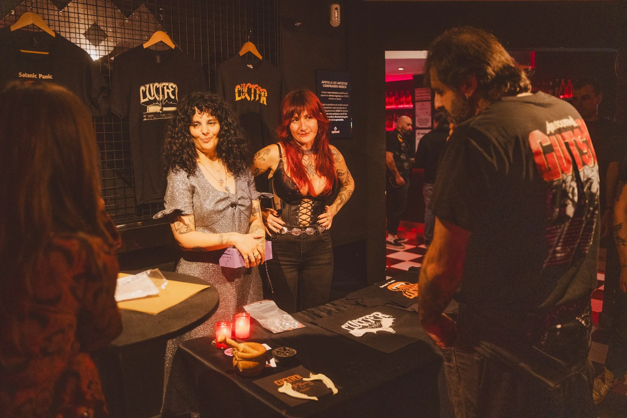 people socializing inside concert venue during event