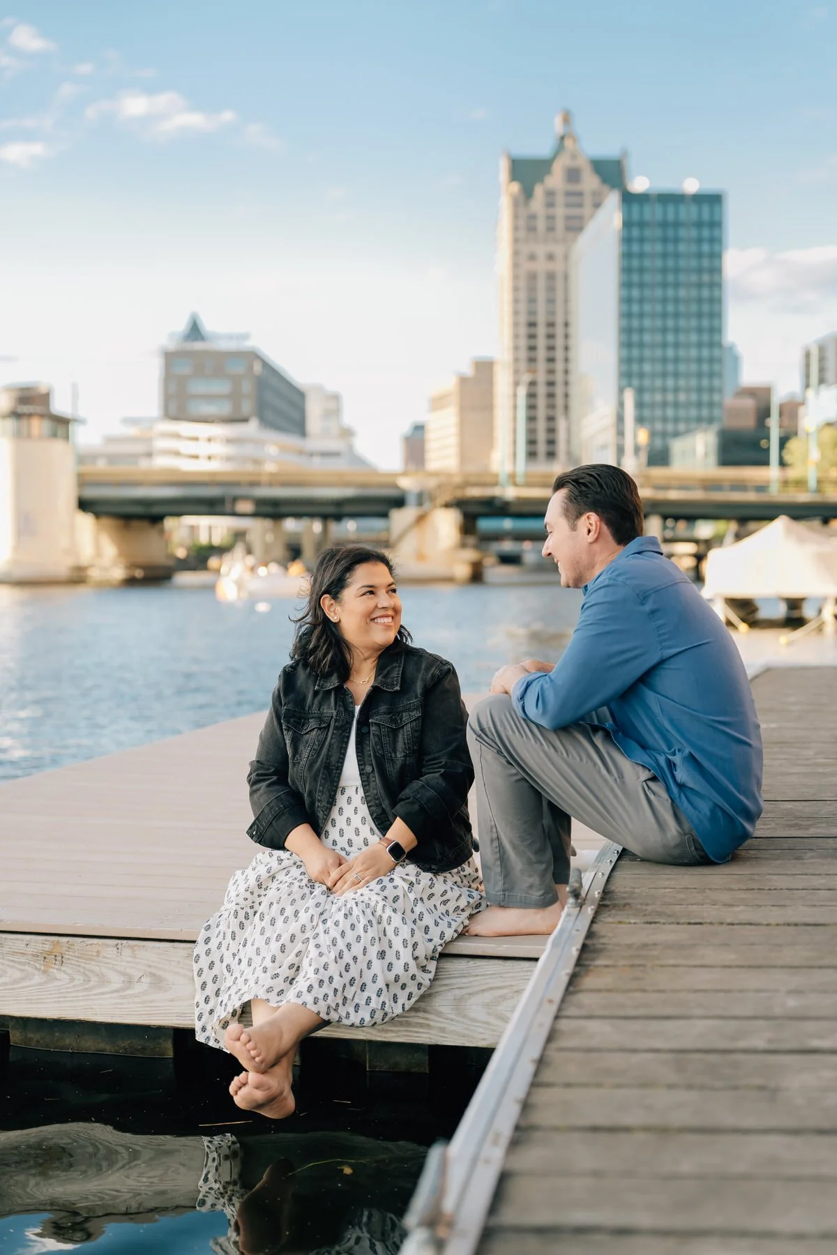 man and woman on dock talking to each other