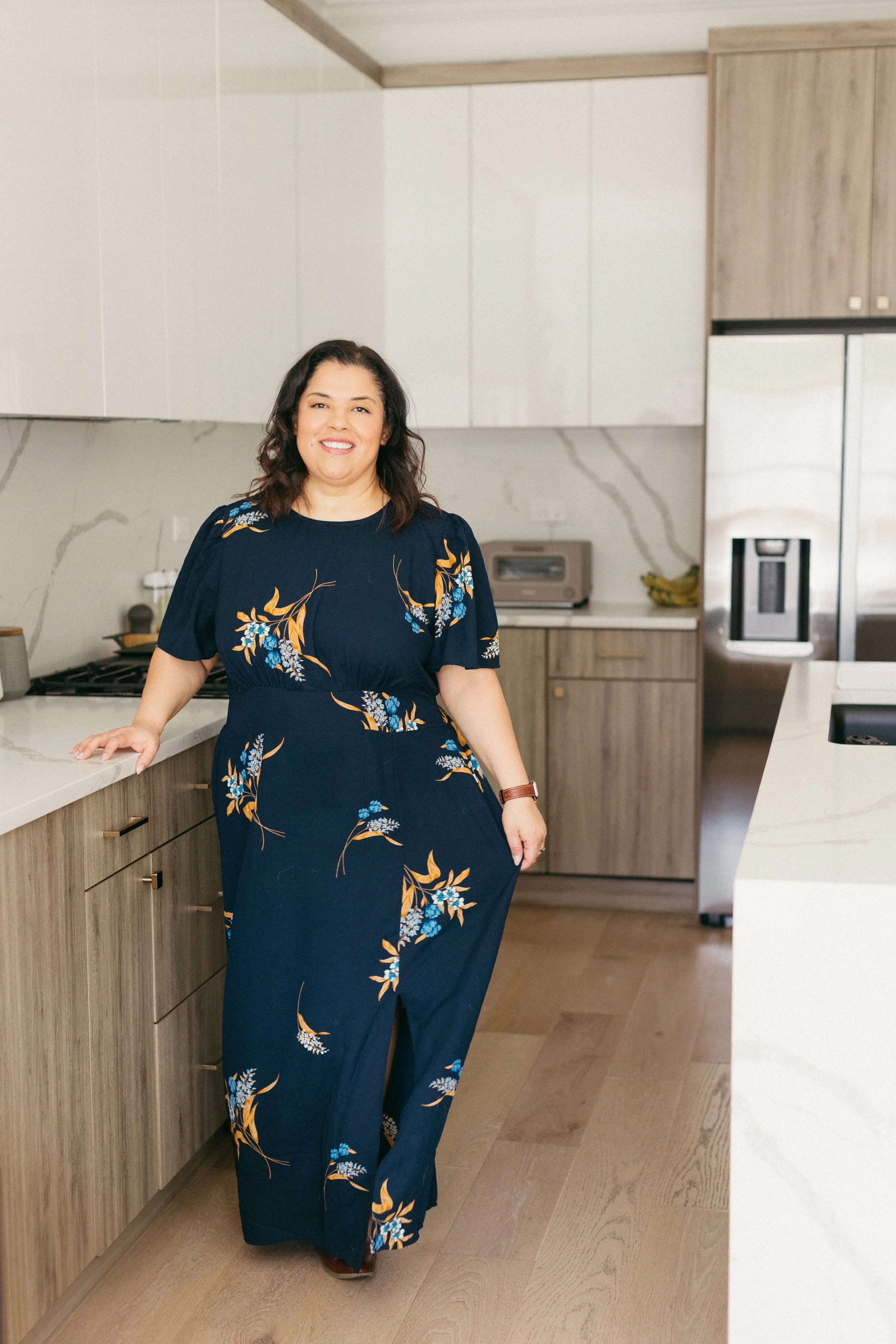 woman standing in kitchen for a brand shoot
