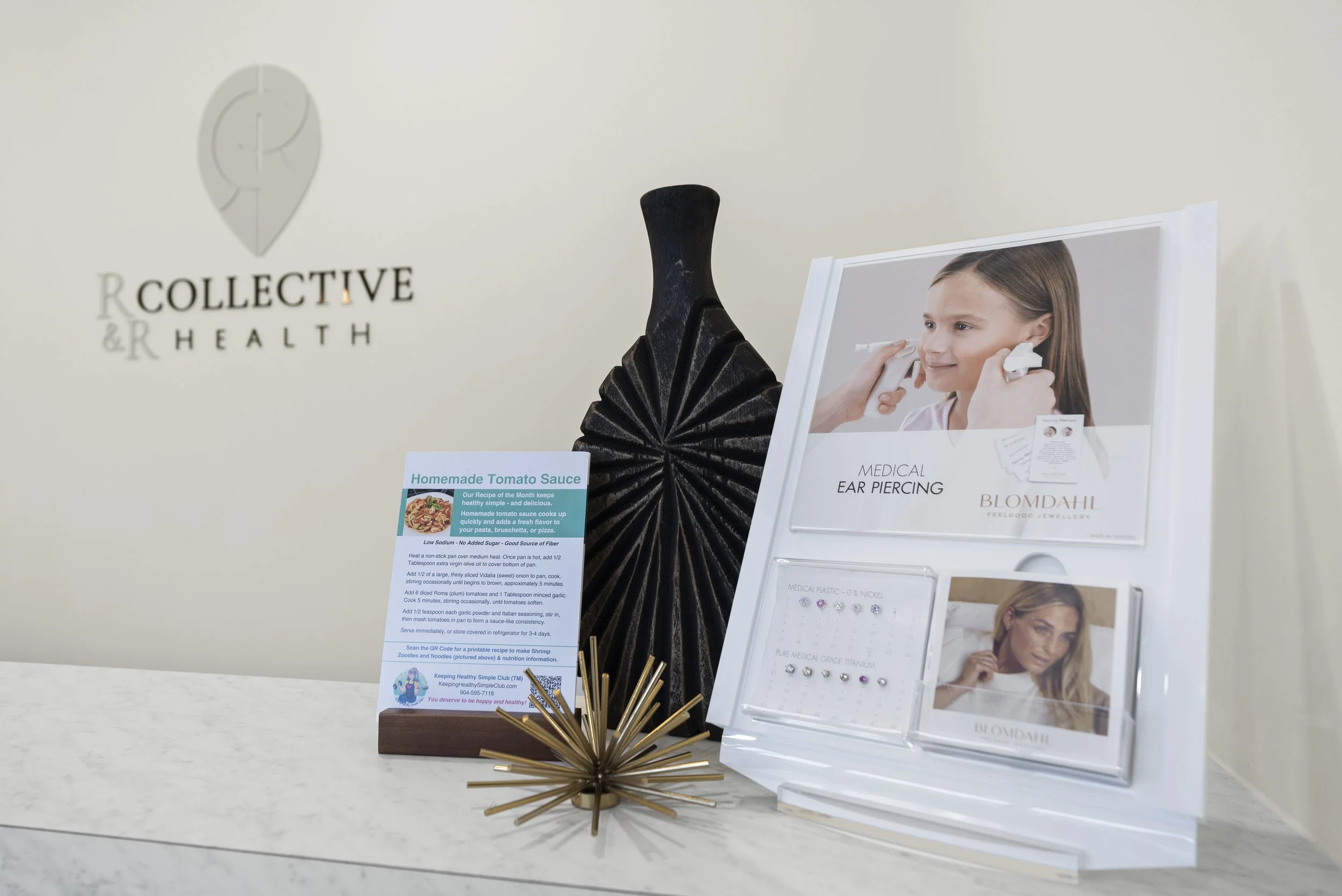 Reception area display inside R & R Collective Health’s St. Johns, Florida clinic.