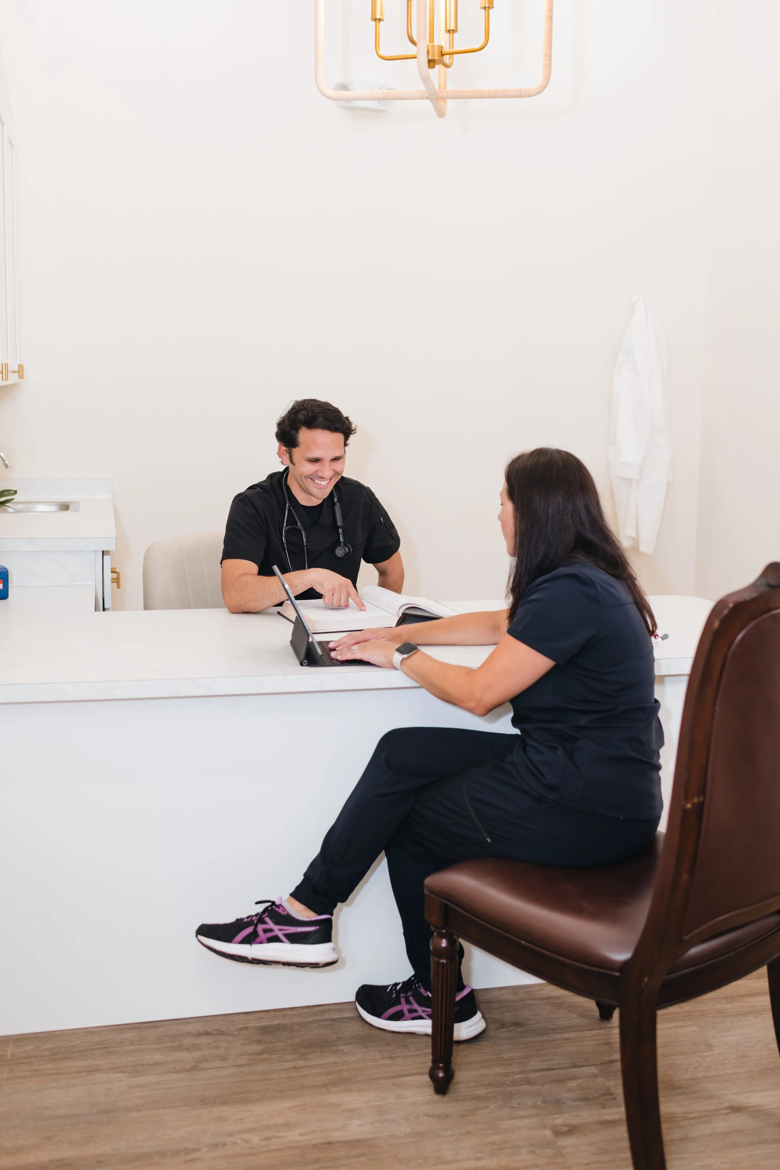 One-on-one conversation between provider and patient at R & R Collective Health.
