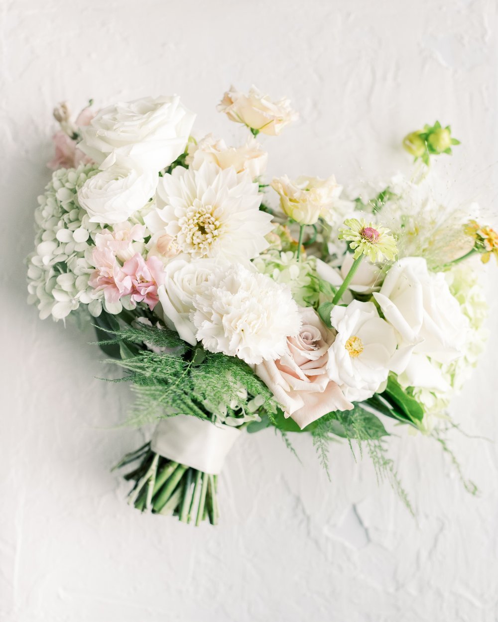 Romantic and timeless in feel, this summer bridal bouquet is thoughtfully designed with soft, seasonal blooms that feel effortlessly elegant. Inspired by the natural beauty of summer in Edmonton, Alberta, it blends classic florals with a light, airy 