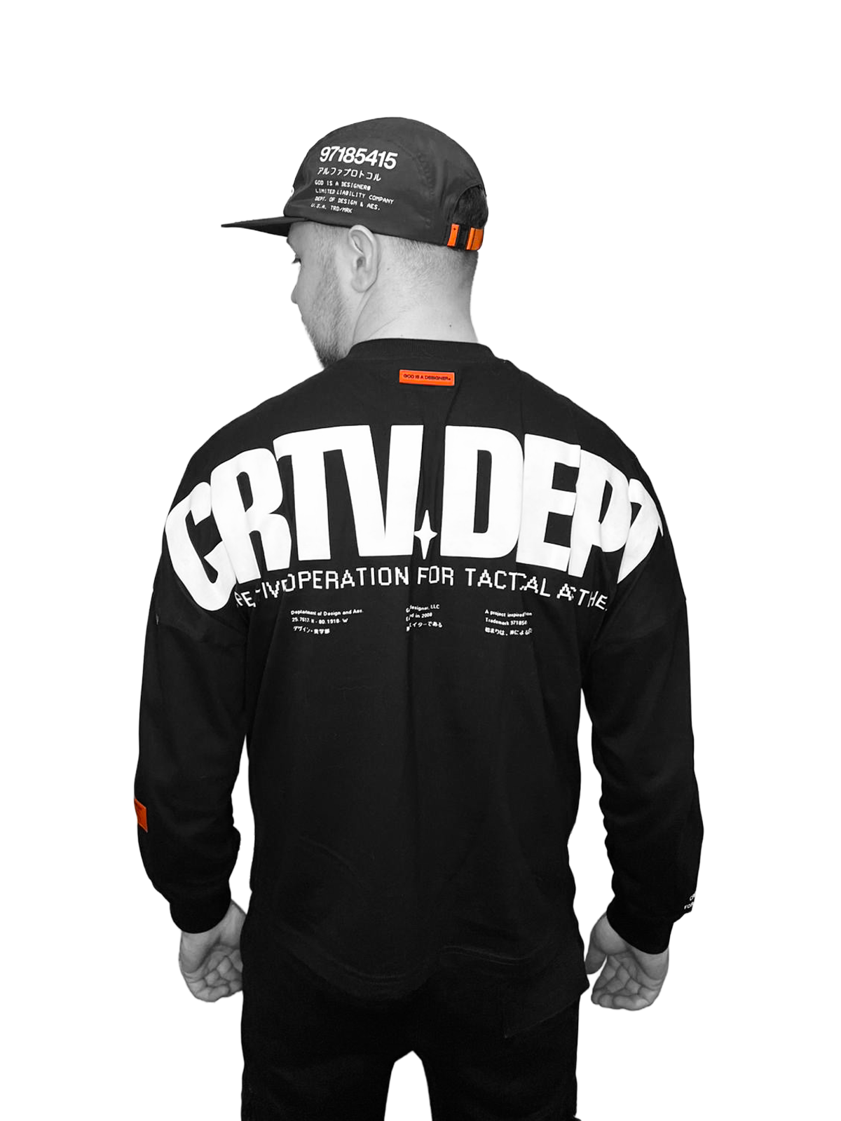 Joe Lane wearing a black creative department graphic top, photographed from behind, reflecting a personal visual identity and brand design aesthetic