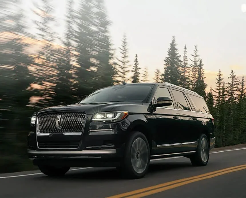 Black luxury SUV providing mountain transportation services from Denver to Colorado destinations.